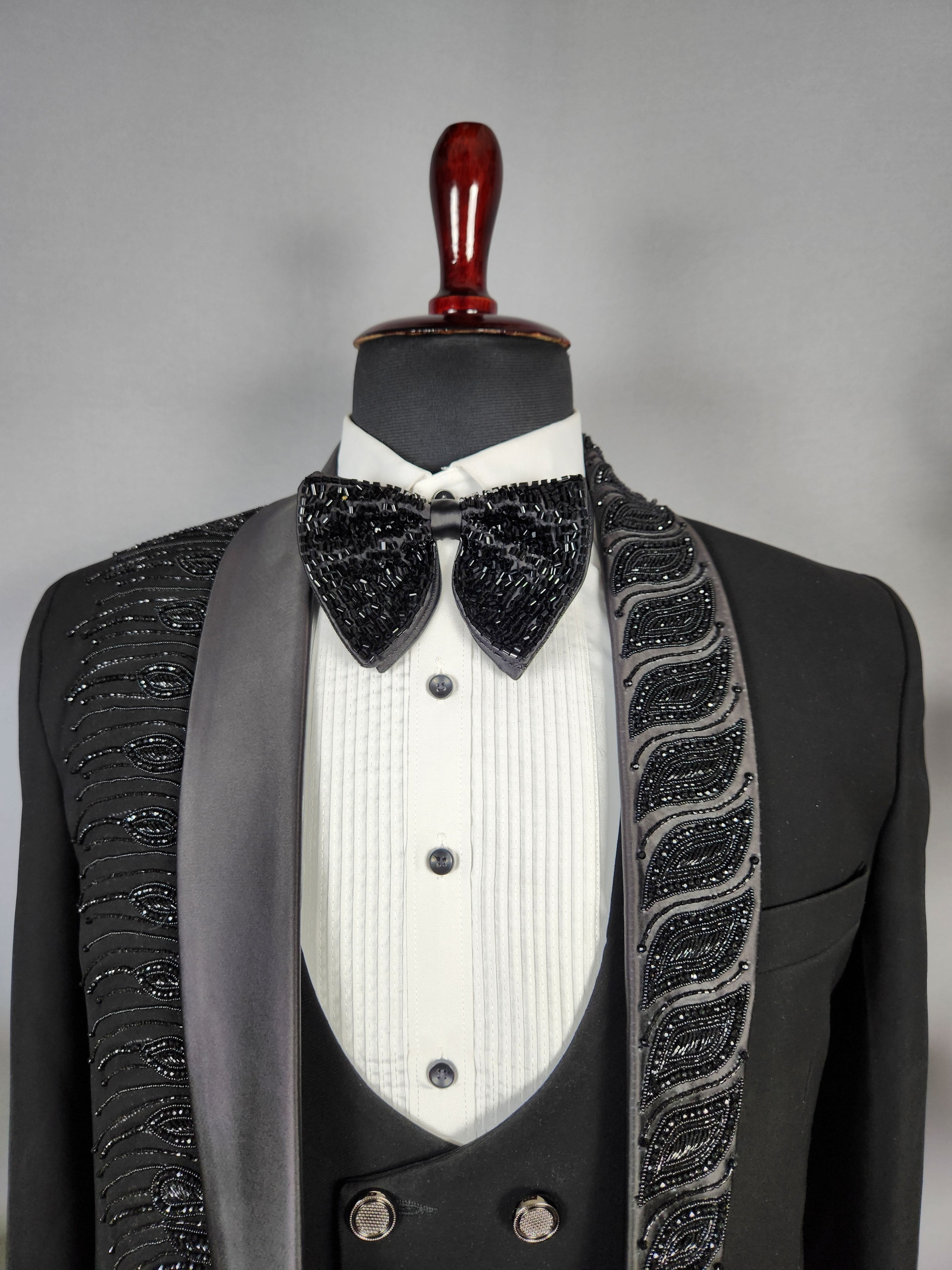 Men's black tuxedo suit for Indian groom, perfect for wedding and reception wear