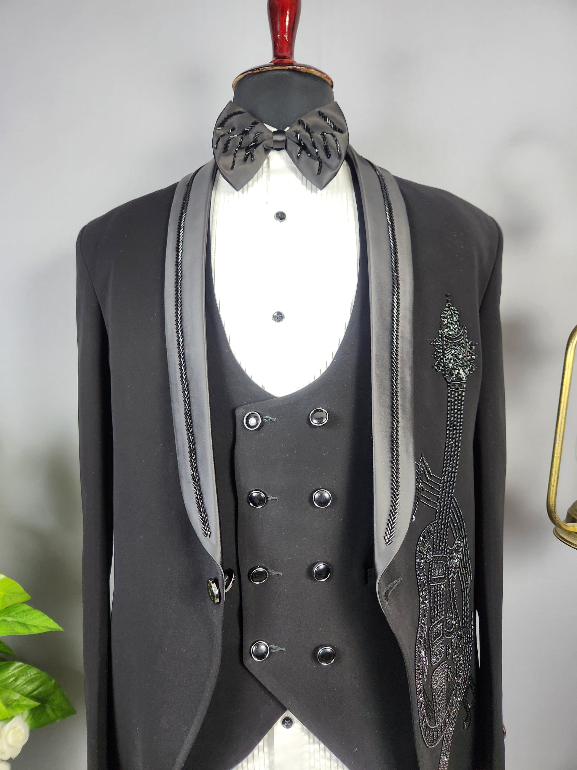 Men's black tuxedo suit for Indian groom, perfect for wedding and reception wear