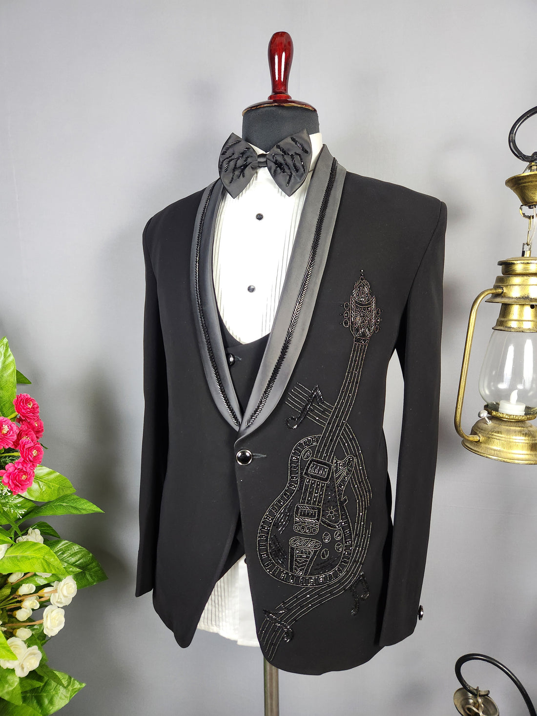 Men's black tuxedo suit for Indian groom, perfect for wedding and reception wear