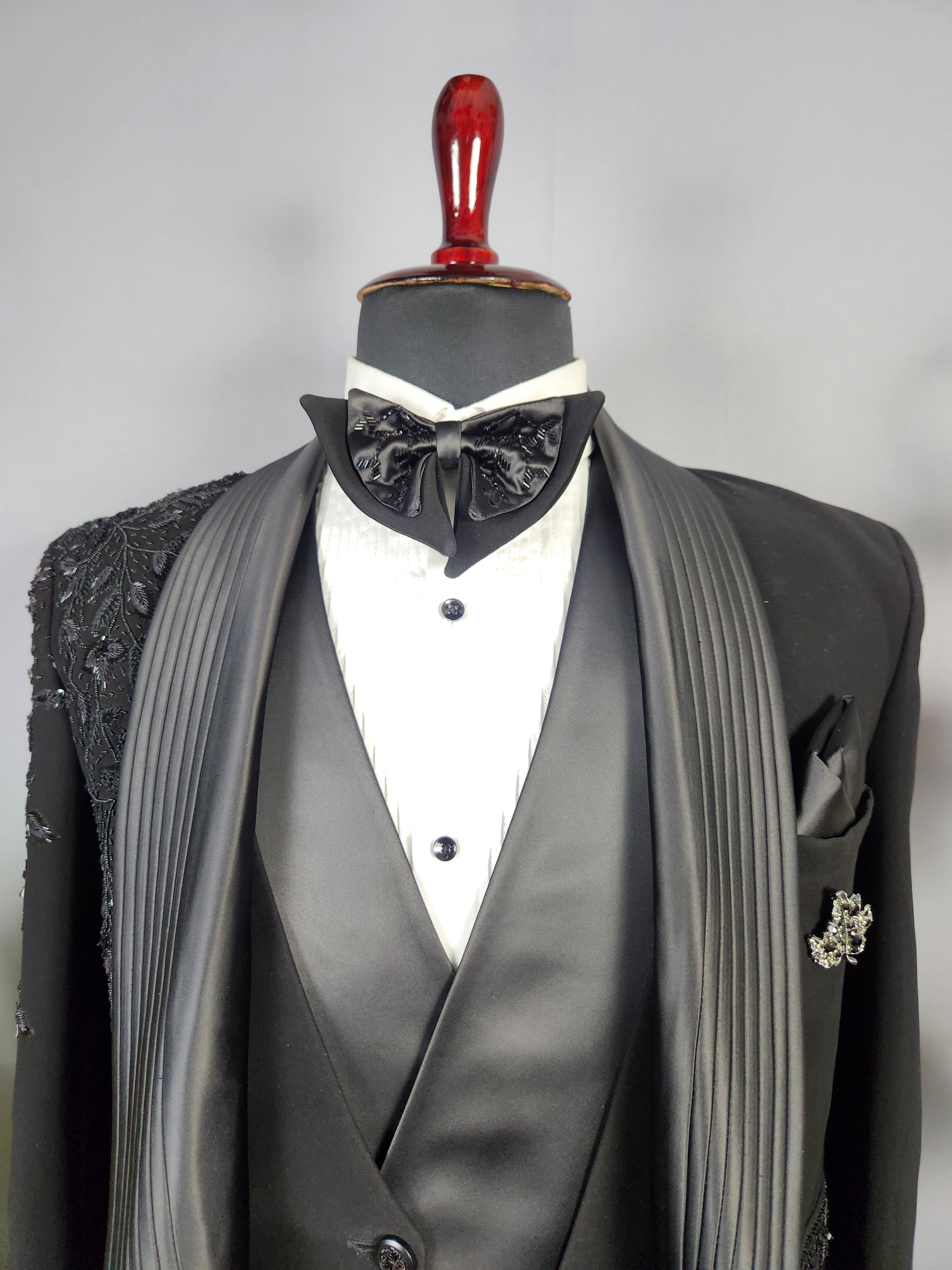 Men's black tuxedo suit for Indian groom, perfect for wedding and reception wear