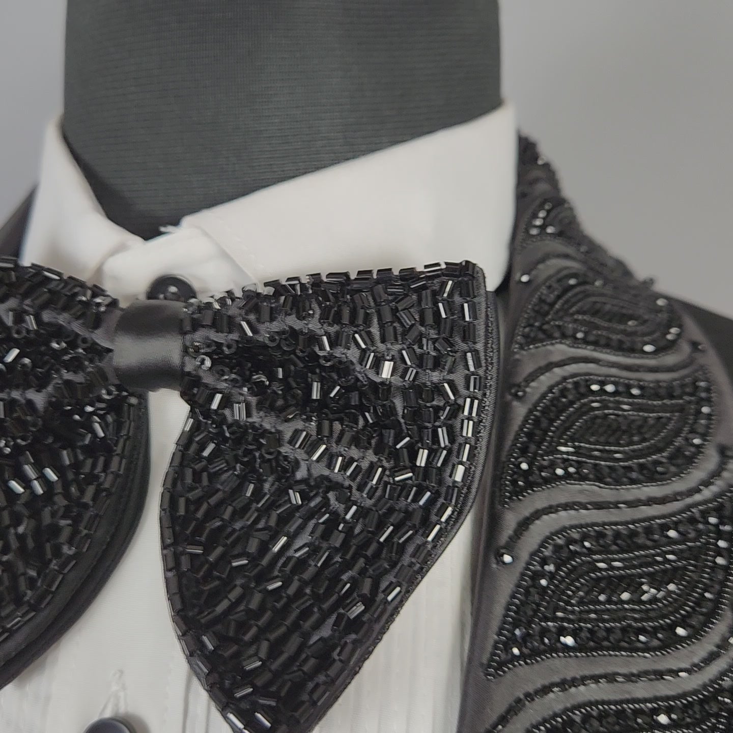 Men's black tuxedo suit for Indian groom, perfect for wedding and reception wear