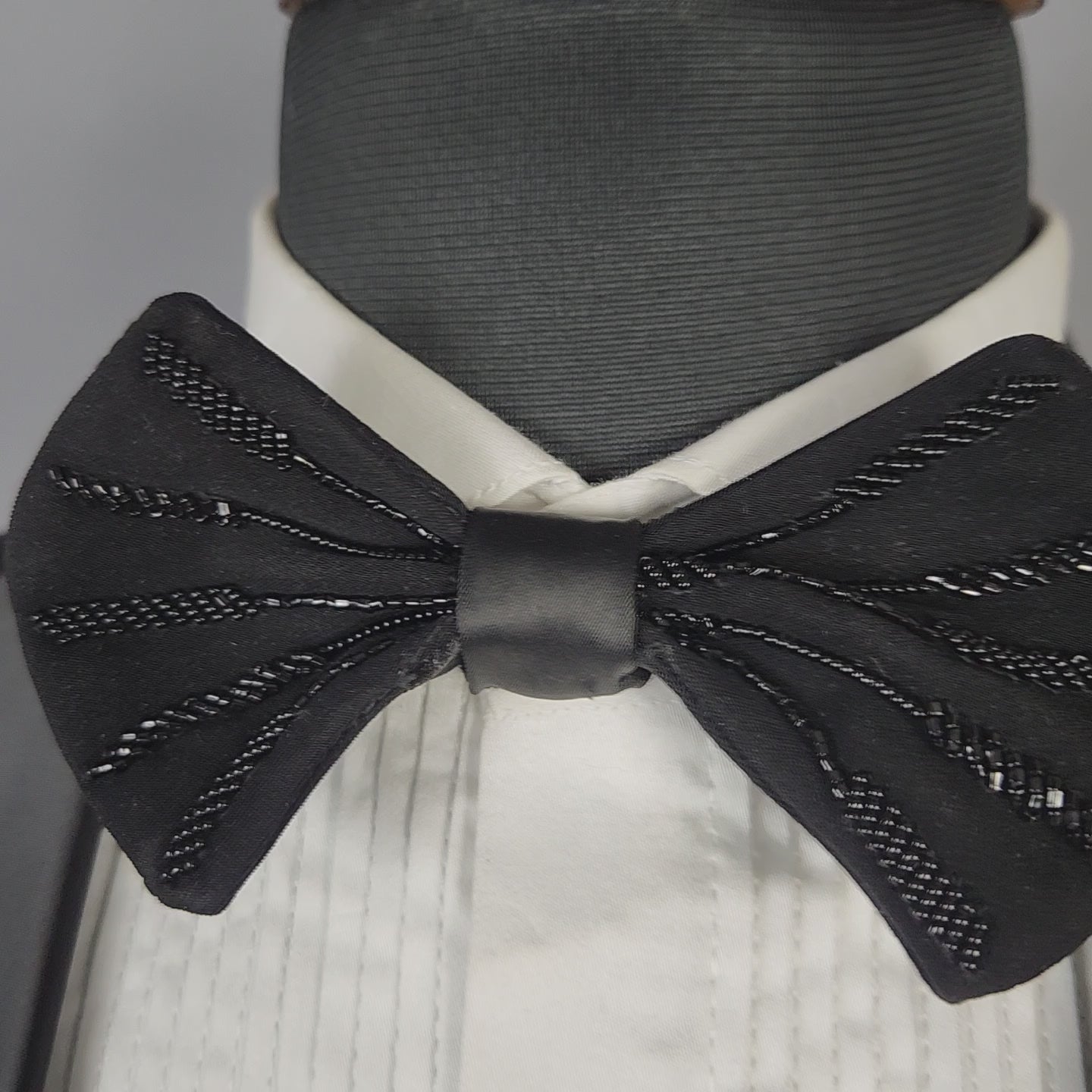 Men's black tuxedo suit for Indian groom, perfect for wedding and reception wear