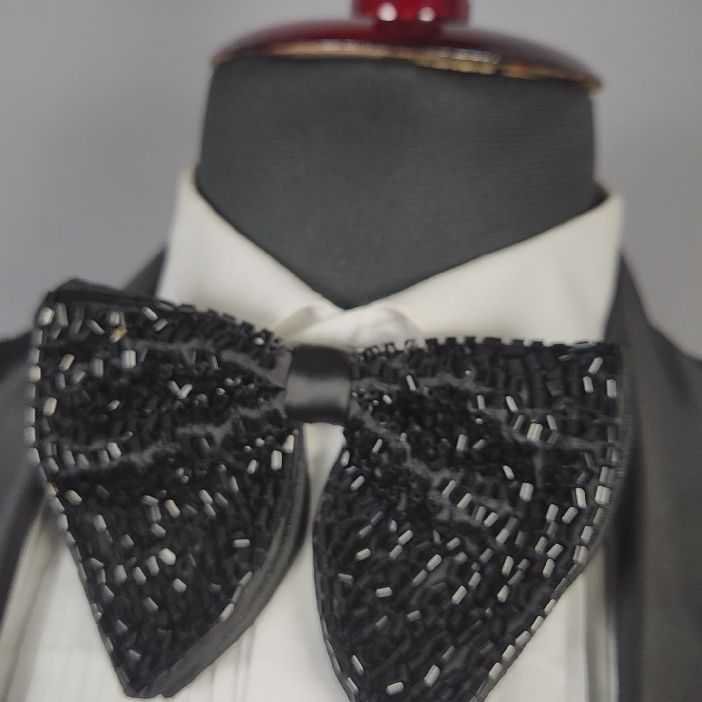 Men's black tuxedo suit for Indian groom, perfect for wedding and reception wear