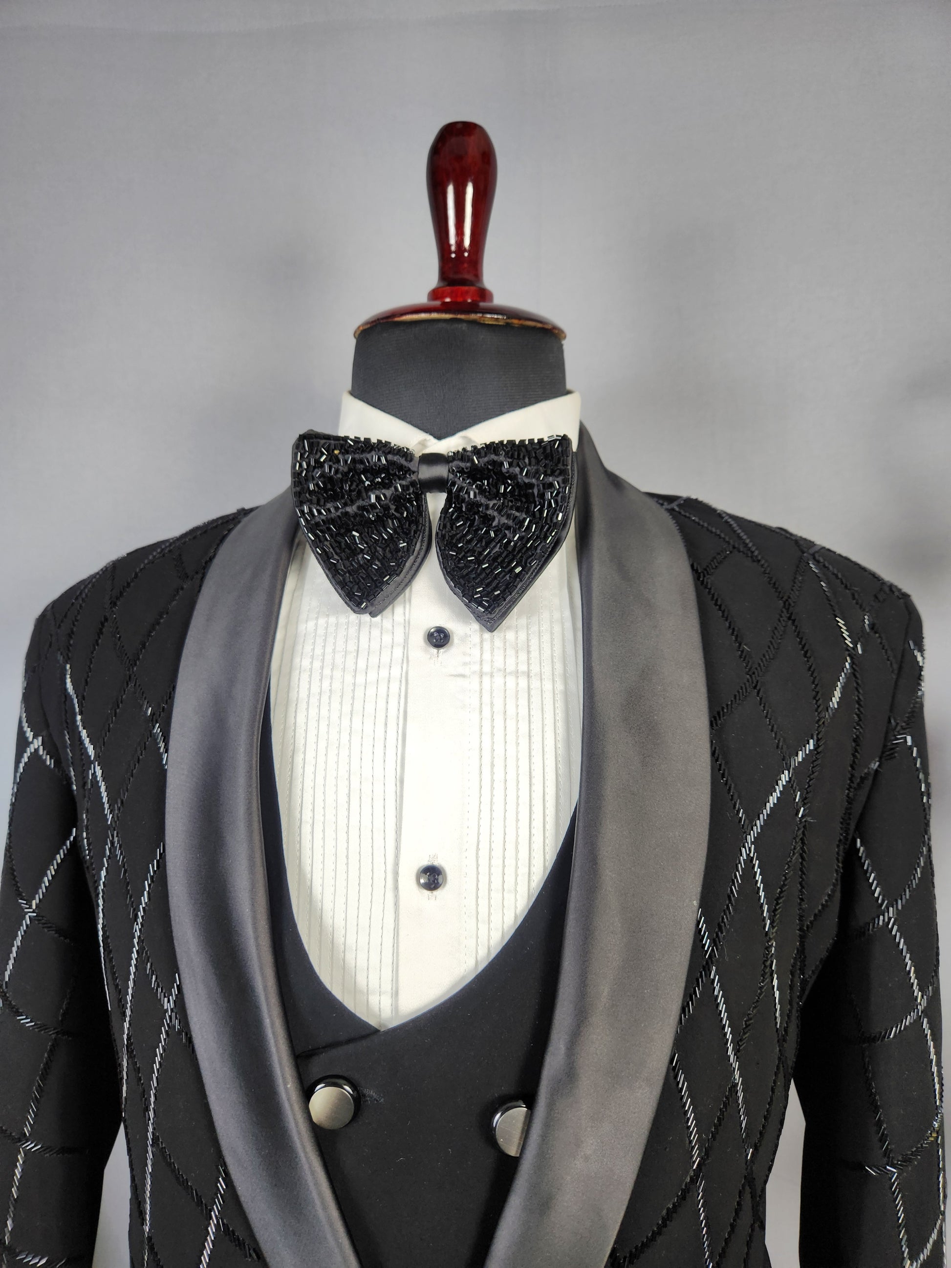 Men's black tuxedo suit for Indian groom, perfect for wedding and reception wear