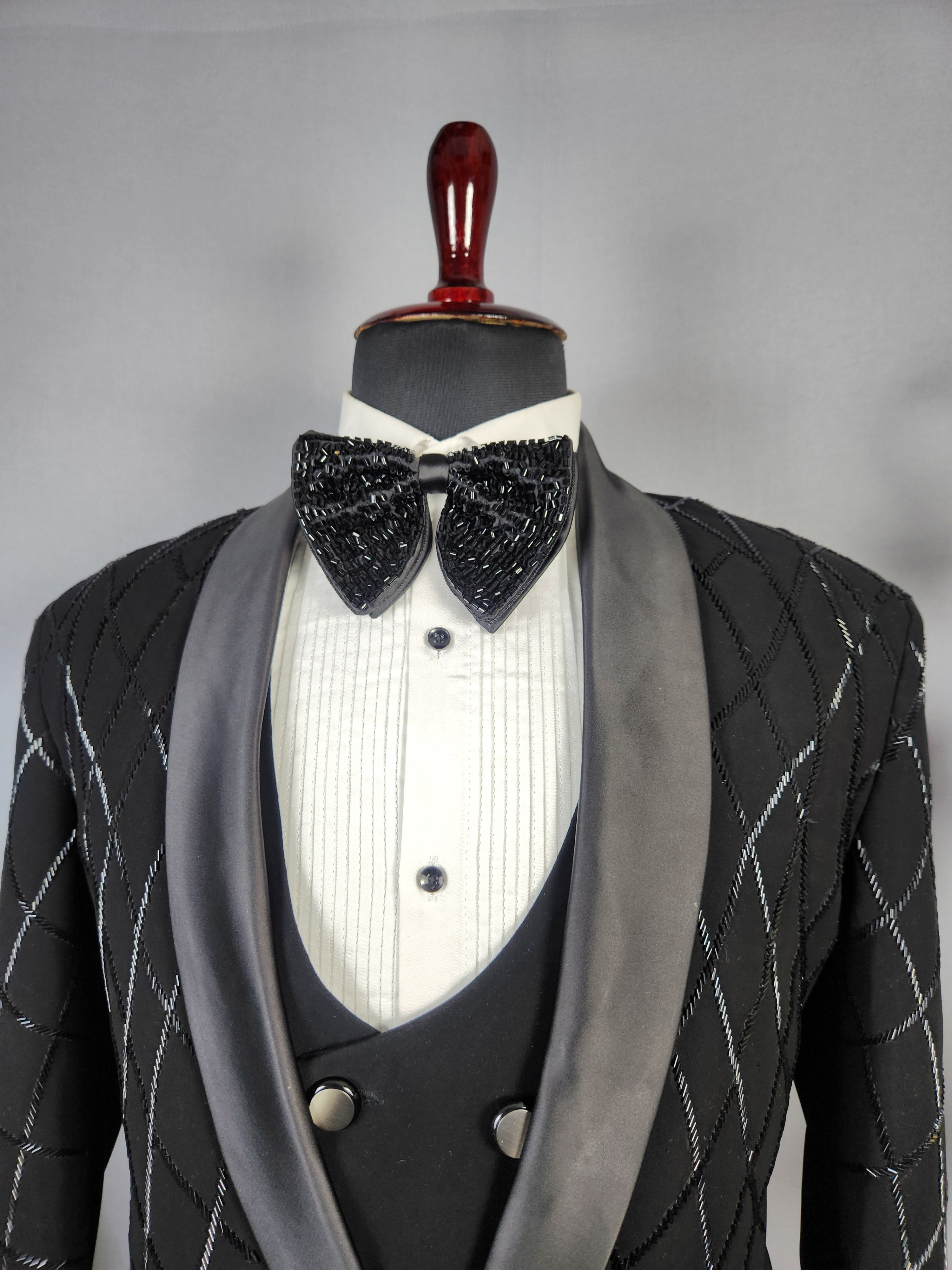 Men's black tuxedo suit for Indian groom, perfect for wedding and reception wear