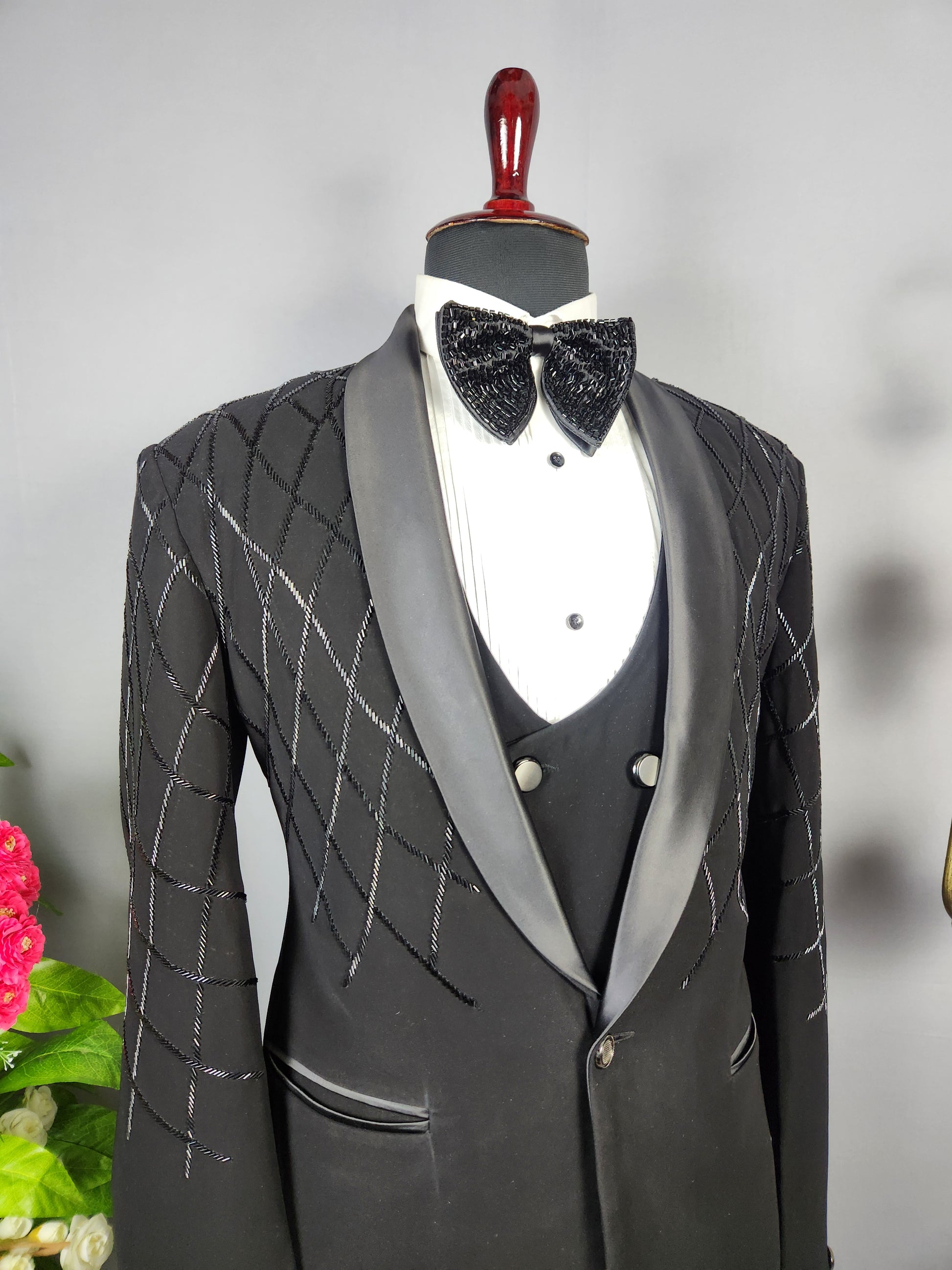 Men's black tuxedo suit for Indian groom, perfect for wedding and reception wear