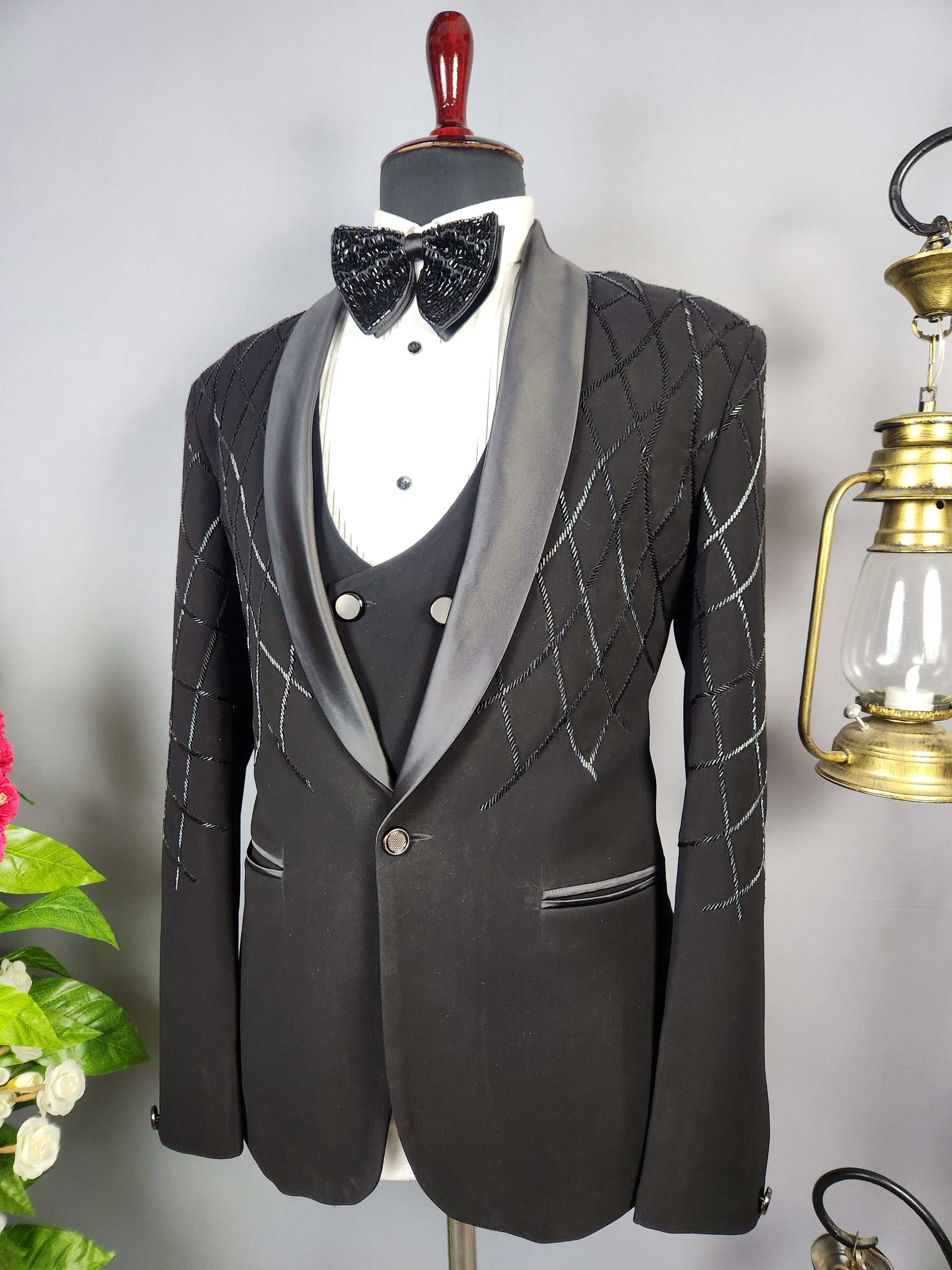 Men's black tuxedo suit for Indian groom, perfect for wedding and reception wear
