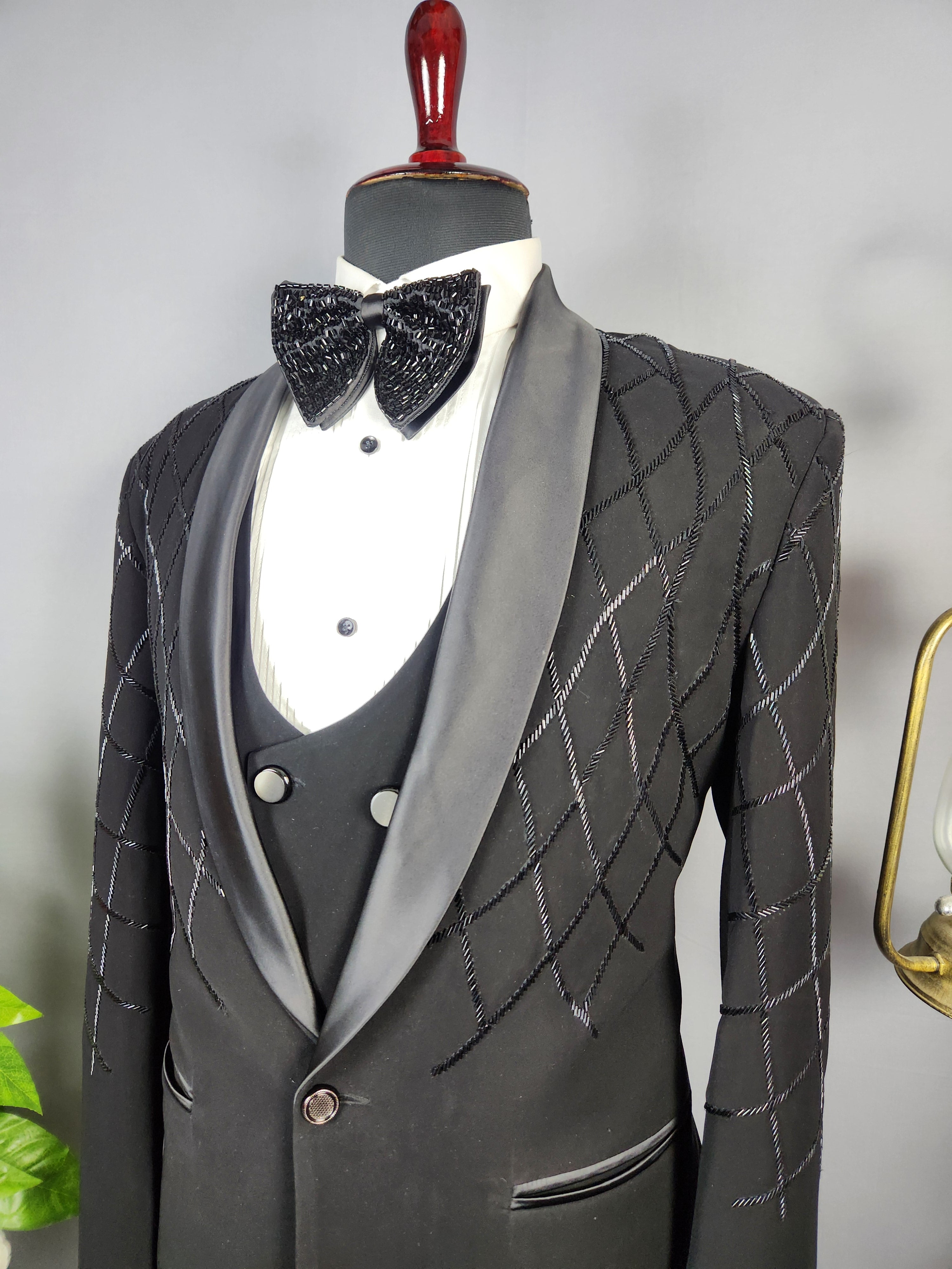 Men's black tuxedo suit for Indian groom, perfect for wedding and reception wear