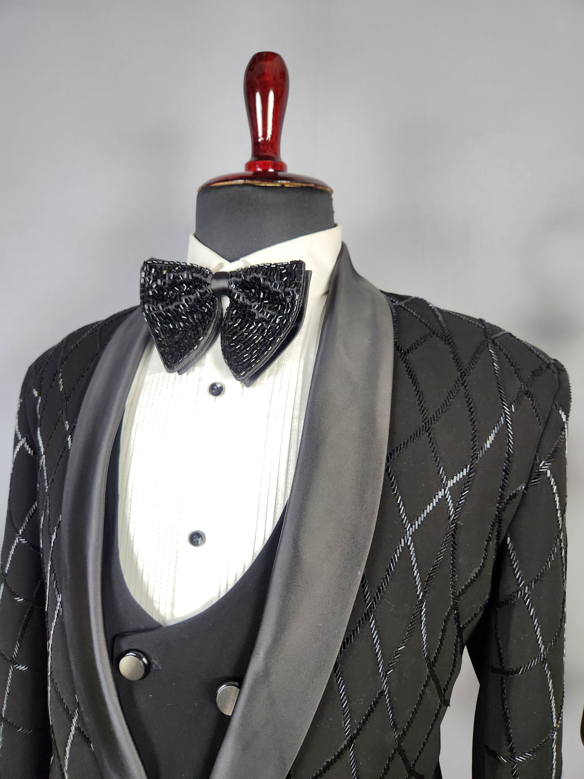 Men's black tuxedo suit for Indian groom, perfect for wedding and reception wear