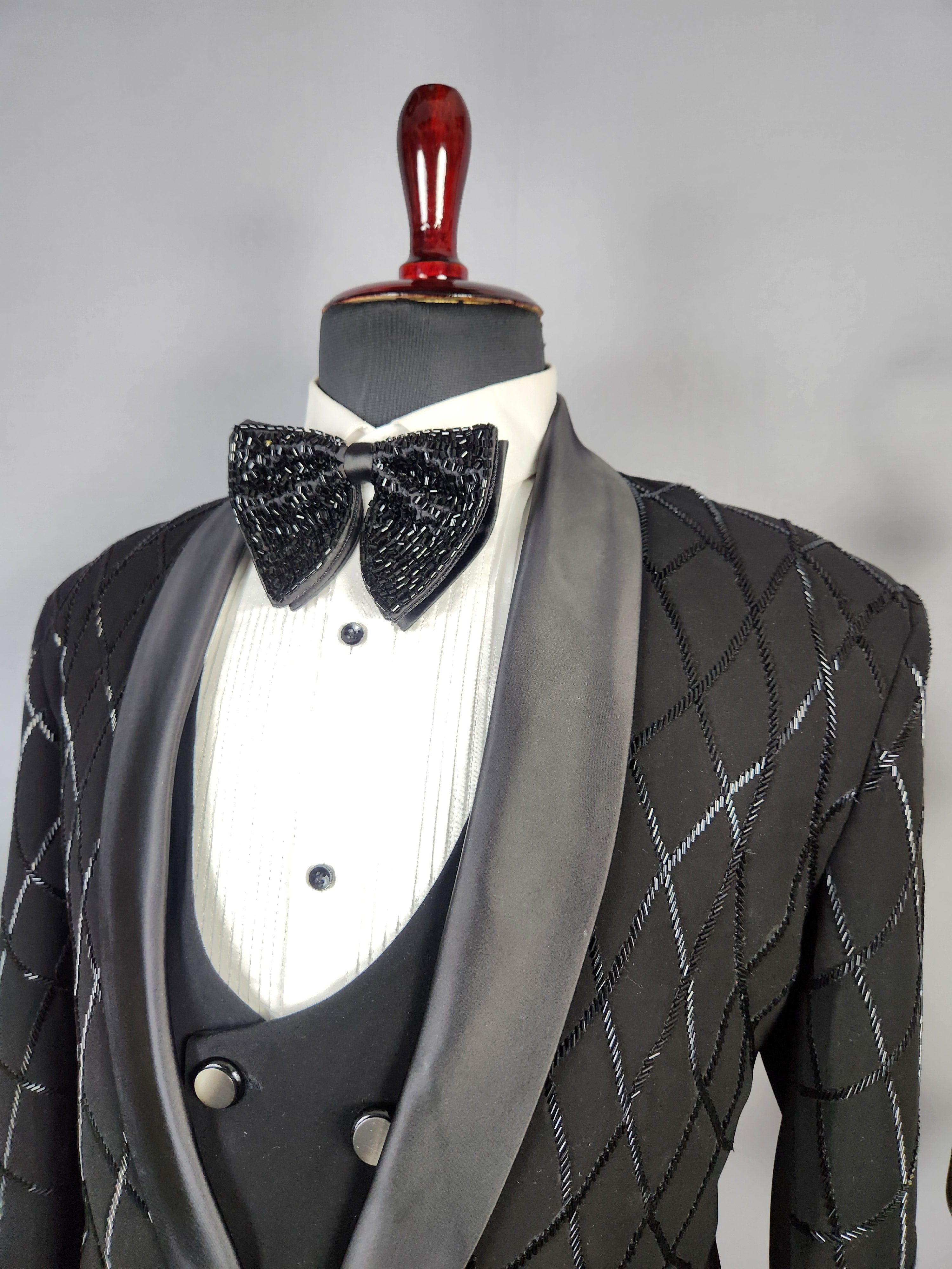 Men's black tuxedo suit for Indian groom, perfect for wedding and reception wear