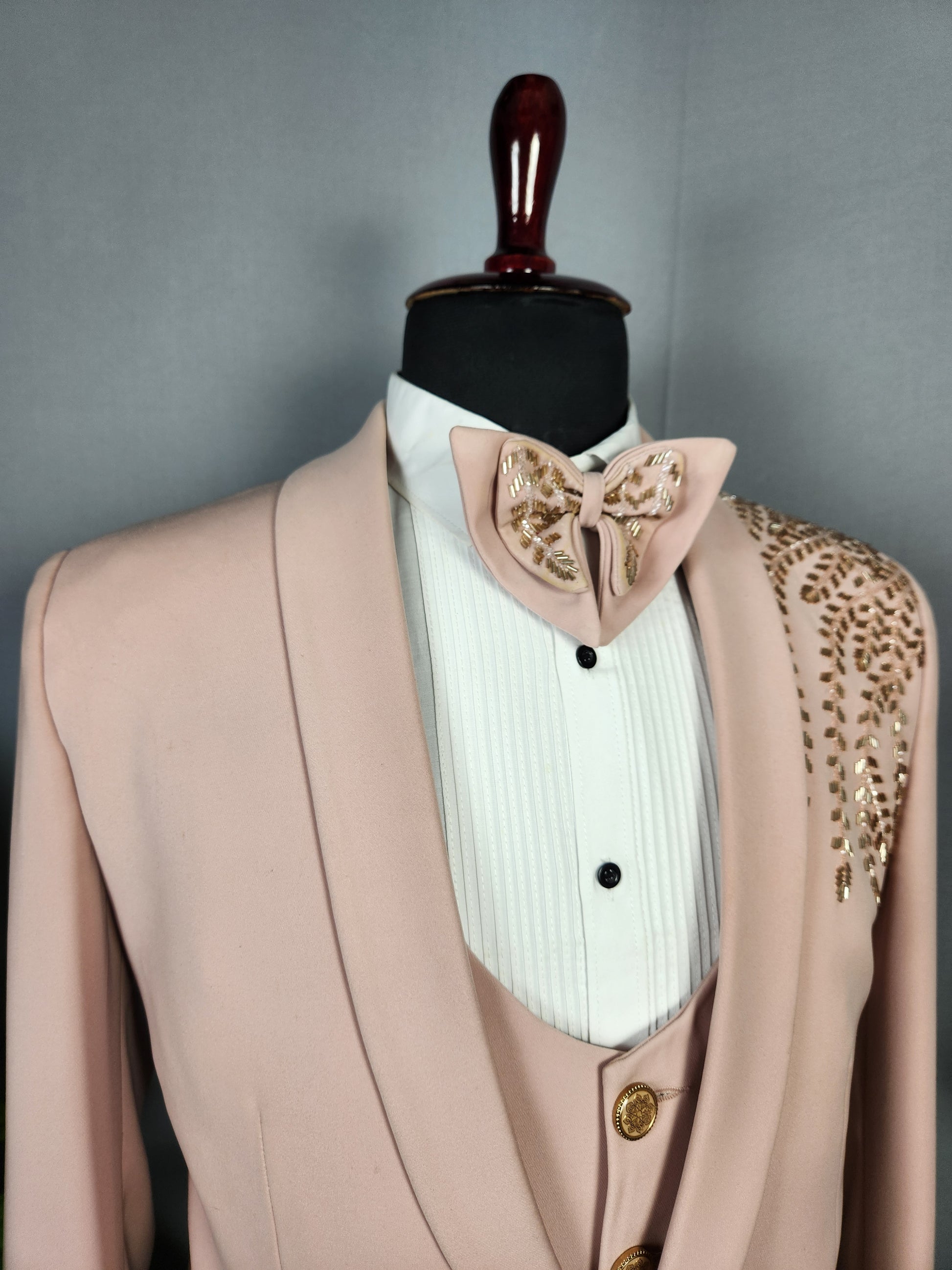 Men's dusty pink tuxedo suit for Indian groom, perfect for wedding and reception wear

