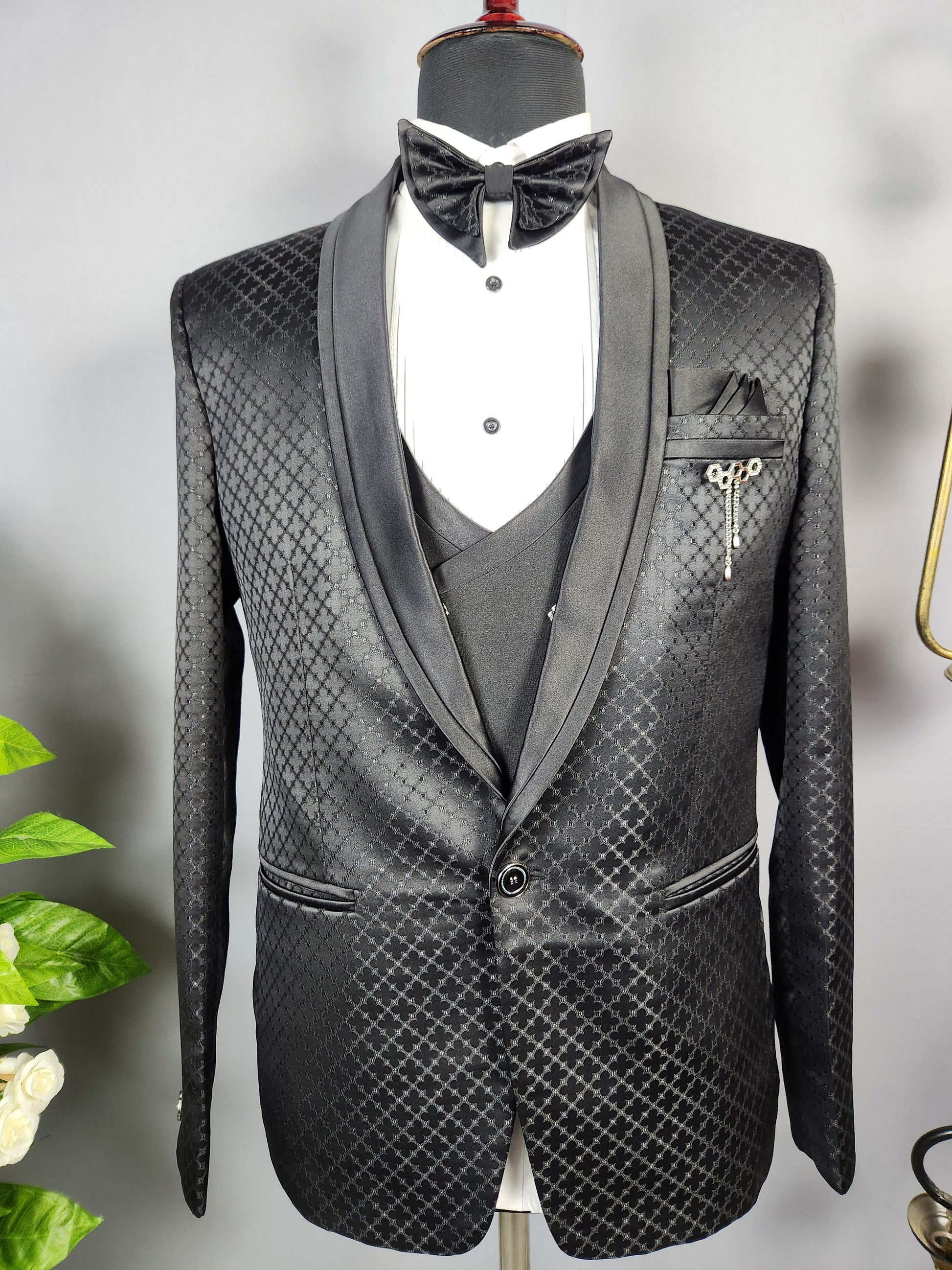 Men's black tuxedo suit for Indian groom, perfect for wedding and reception wear
