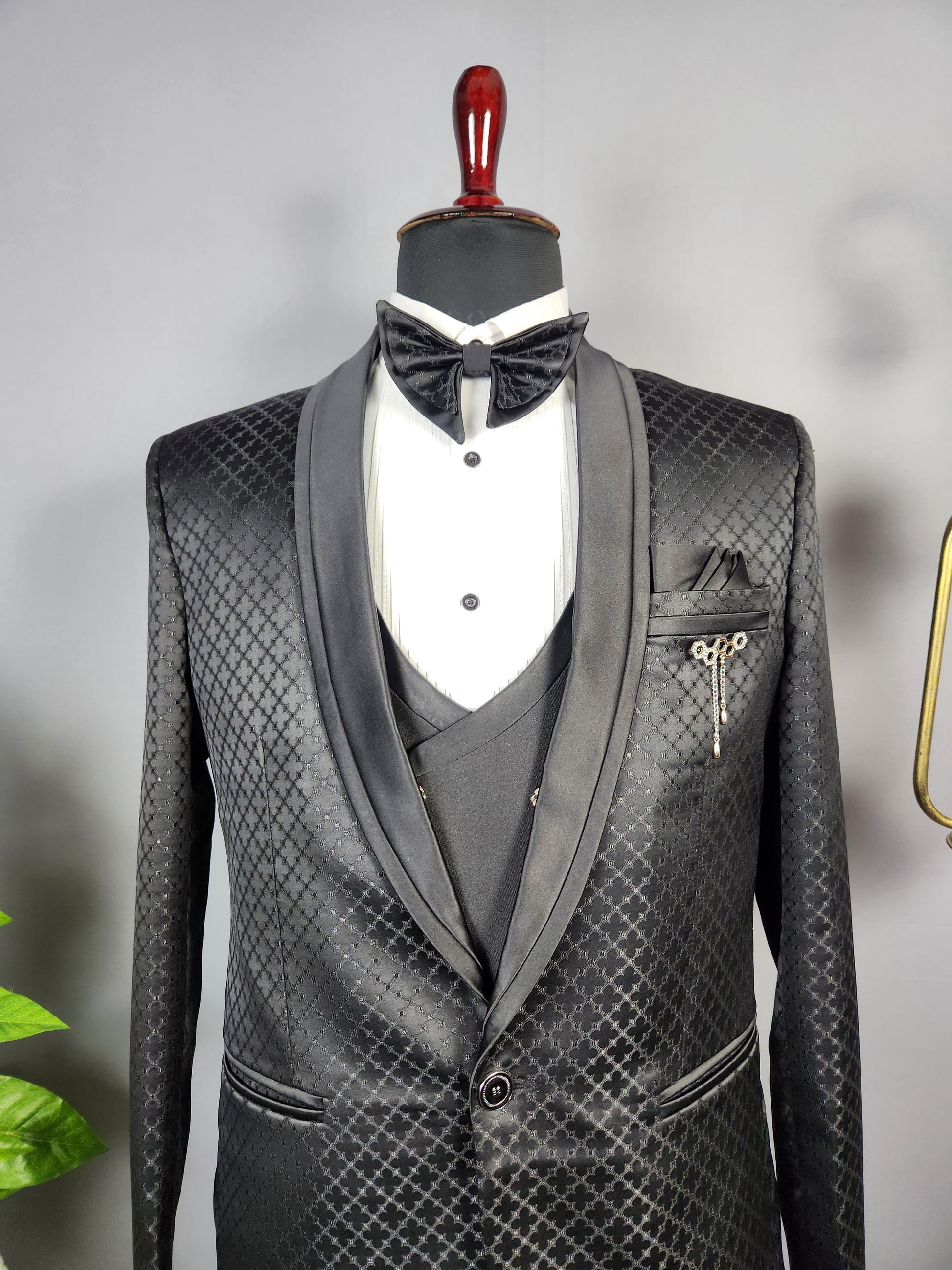 Men's black tuxedo suit for Indian groom, perfect for wedding and reception wear
