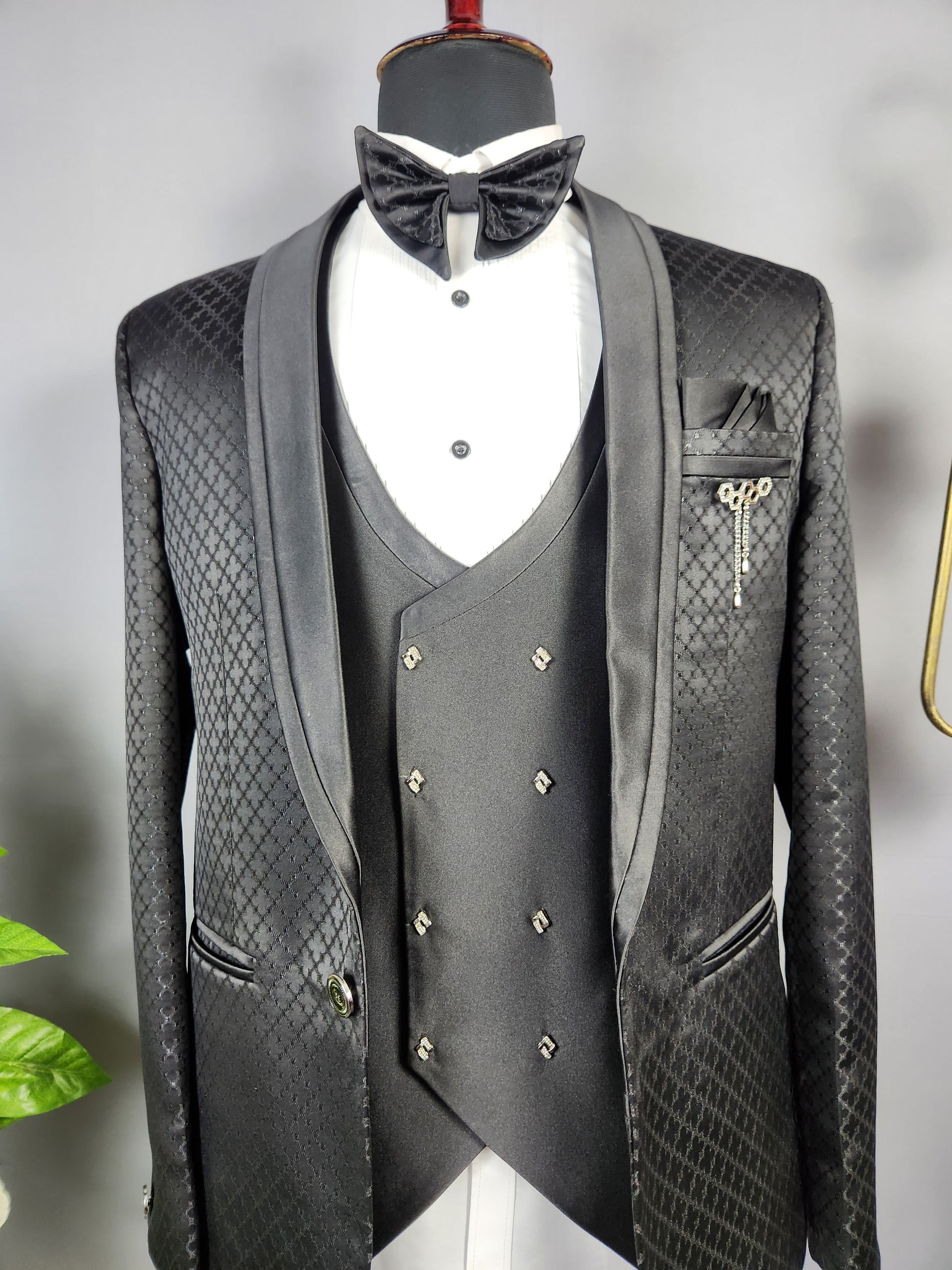 Men's black tuxedo suit for Indian groom, perfect for wedding and reception wear
