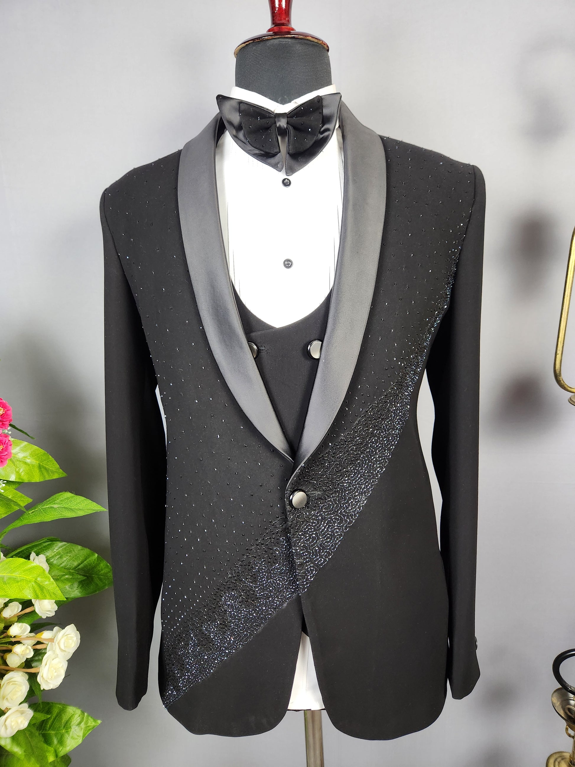 Men's black tuxedo suit for Indian groom, perfect for wedding and reception wear
