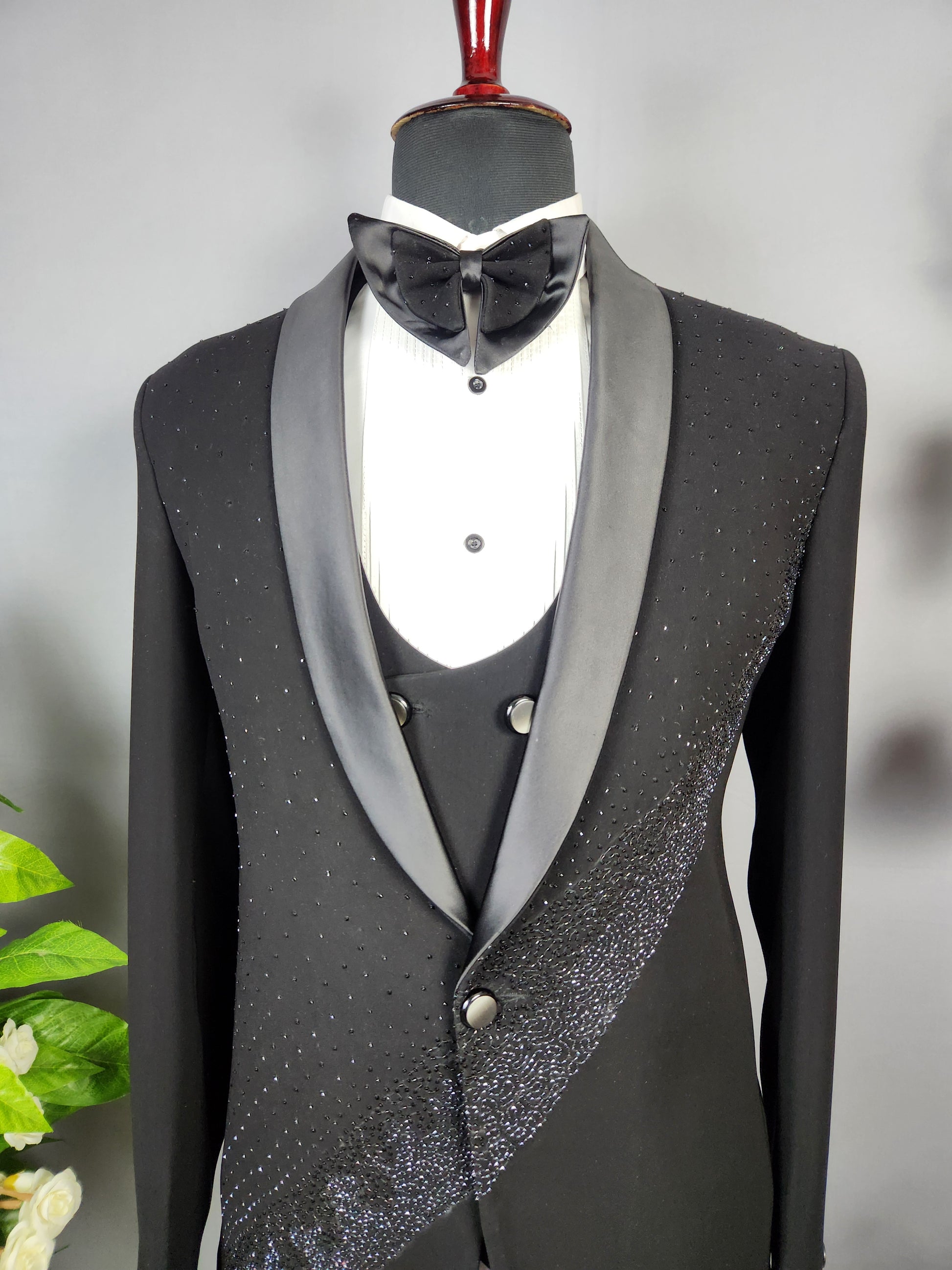 Men's black tuxedo suit for Indian groom, perfect for wedding and reception wear
