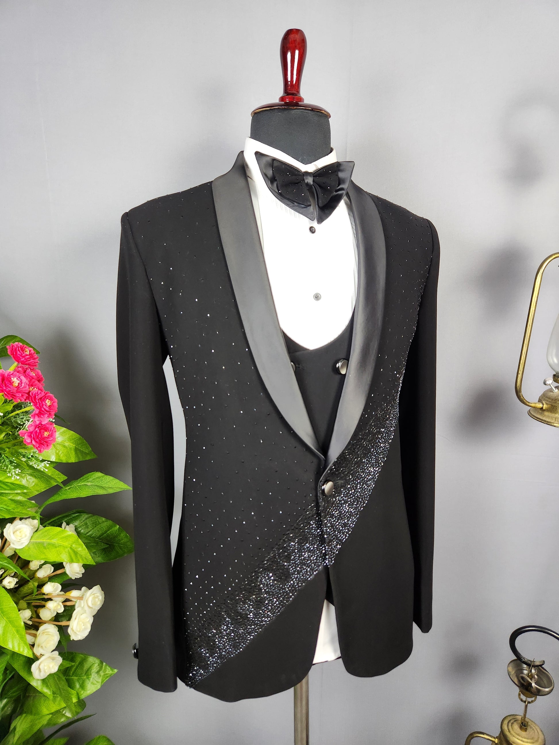 Men's black tuxedo suit for Indian groom, perfect for wedding and reception wear
