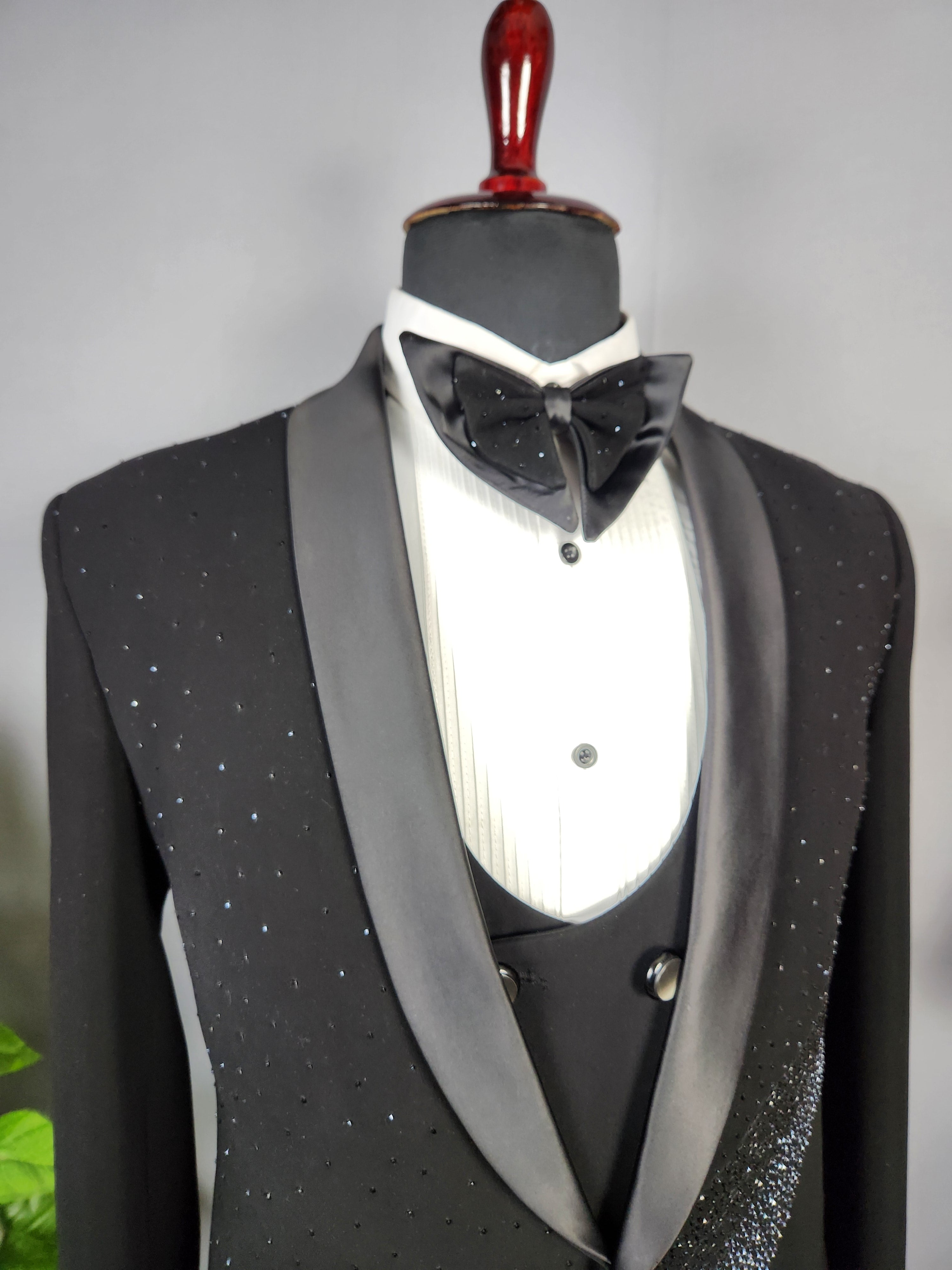 Men's black tuxedo suit for Indian groom, perfect for wedding and reception wear
