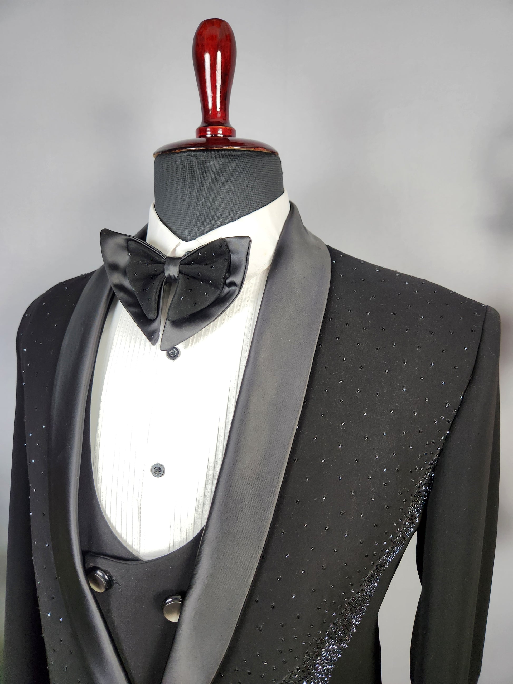 Men's black tuxedo suit for Indian groom, perfect for wedding and reception wear

