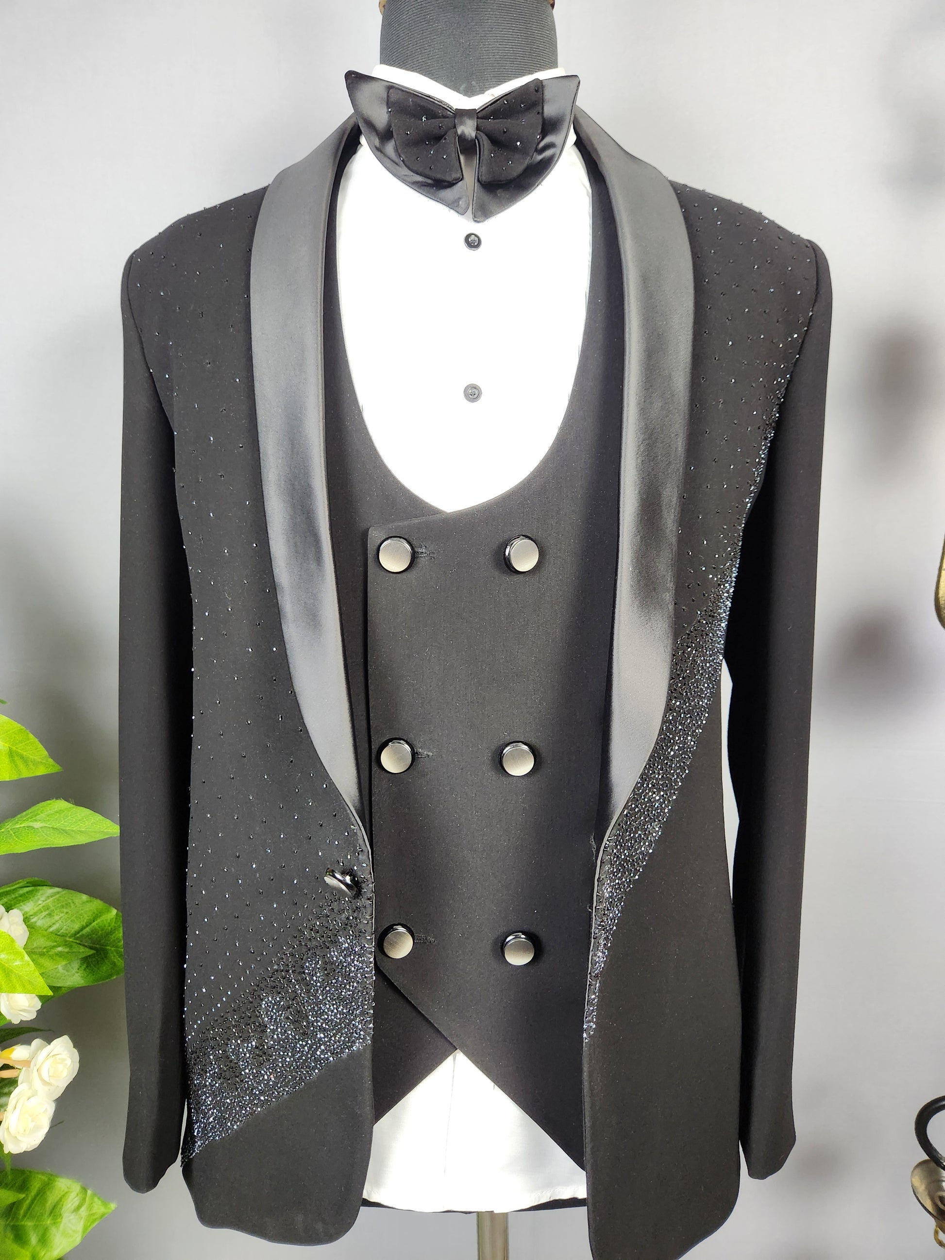 Men's black tuxedo suit for Indian groom, perfect for wedding and reception wear
