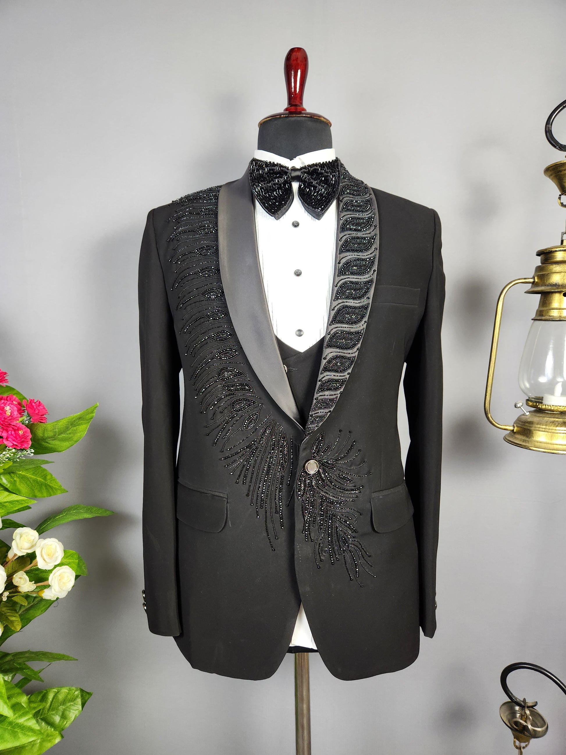 Men's black tuxedo suit for Indian groom, perfect for wedding and reception wear
