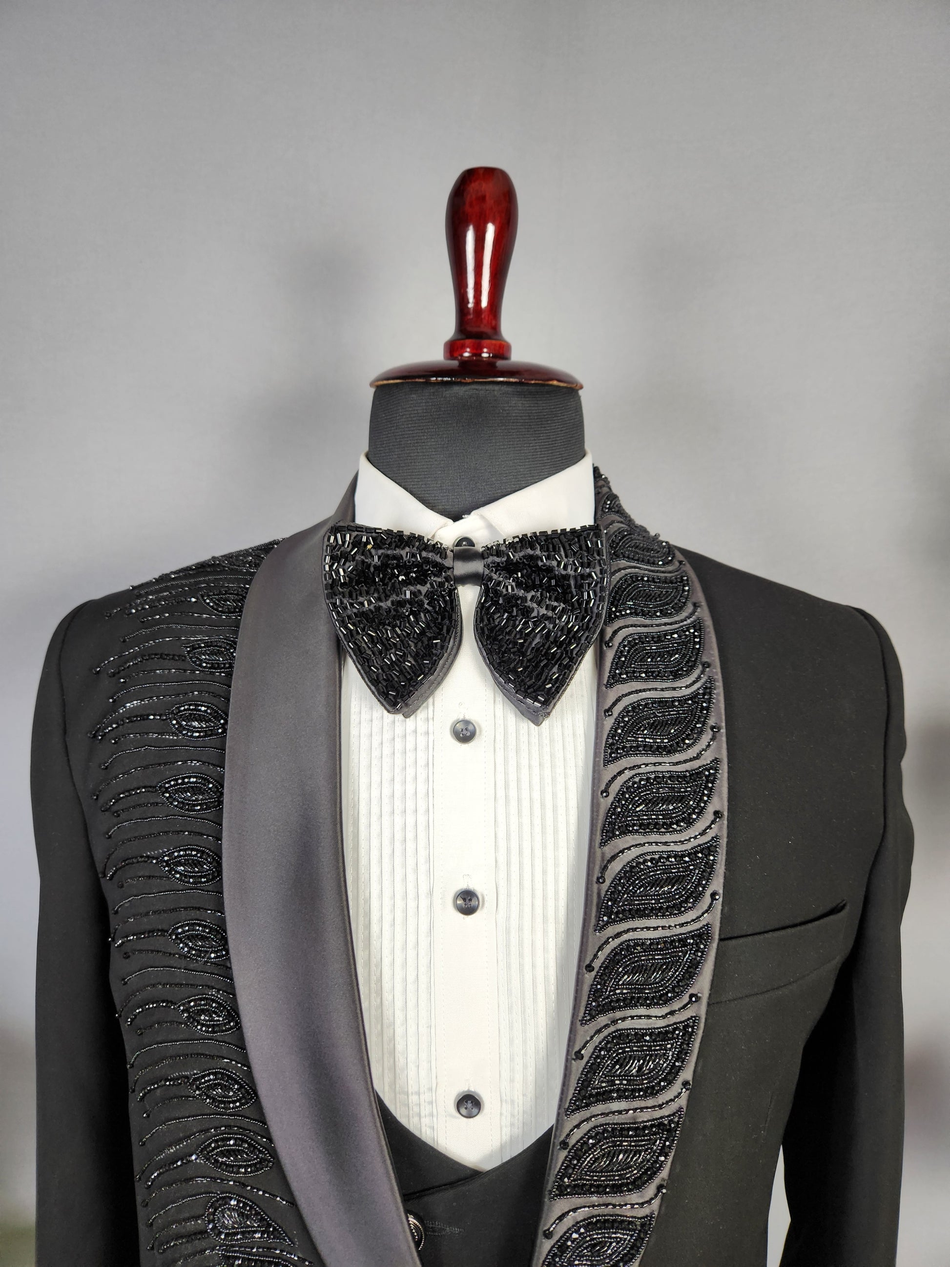 Men's black tuxedo suit for Indian groom, perfect for wedding and reception wear
