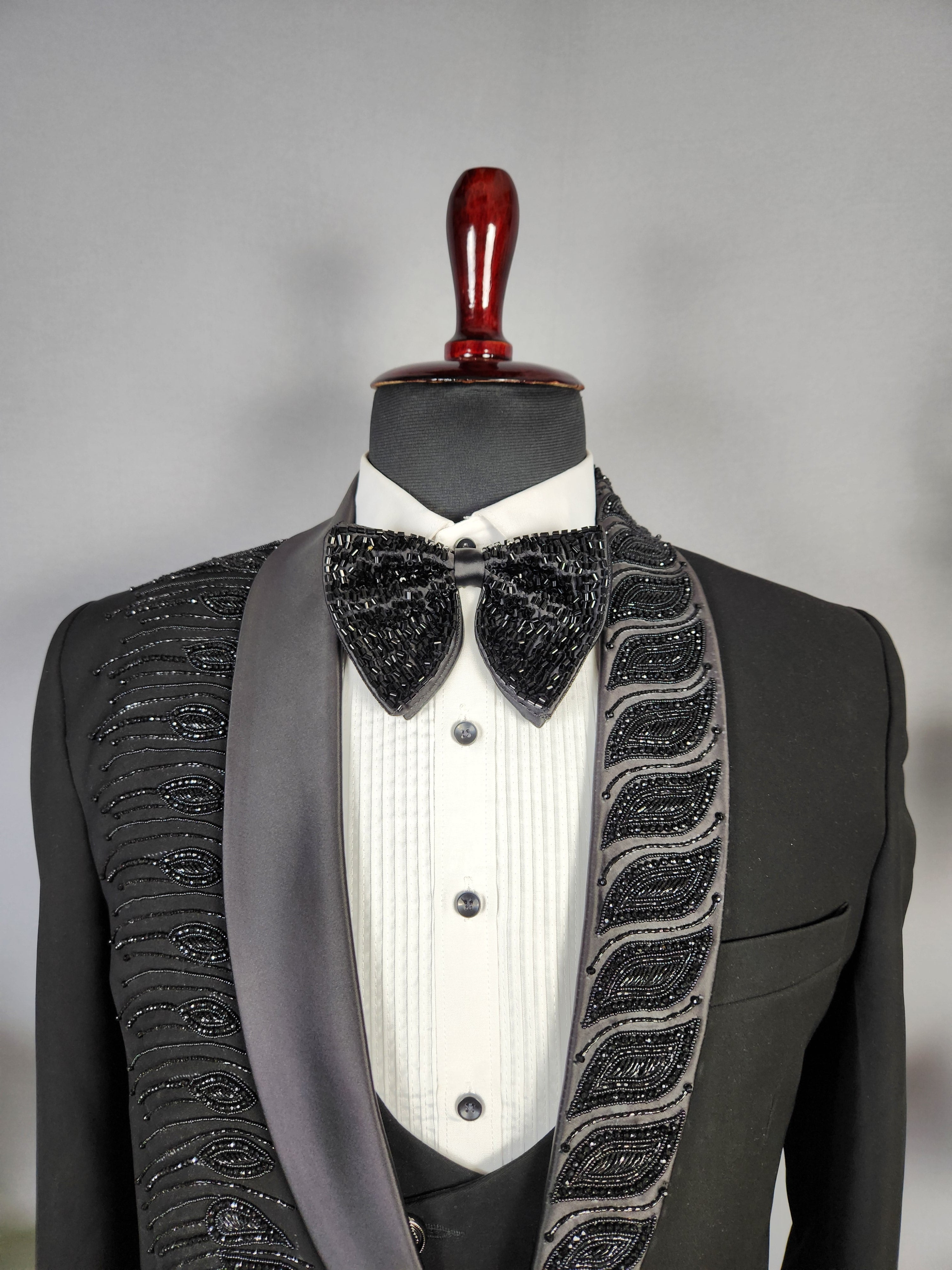 Men's black tuxedo suit for Indian groom, perfect for wedding and reception wear
