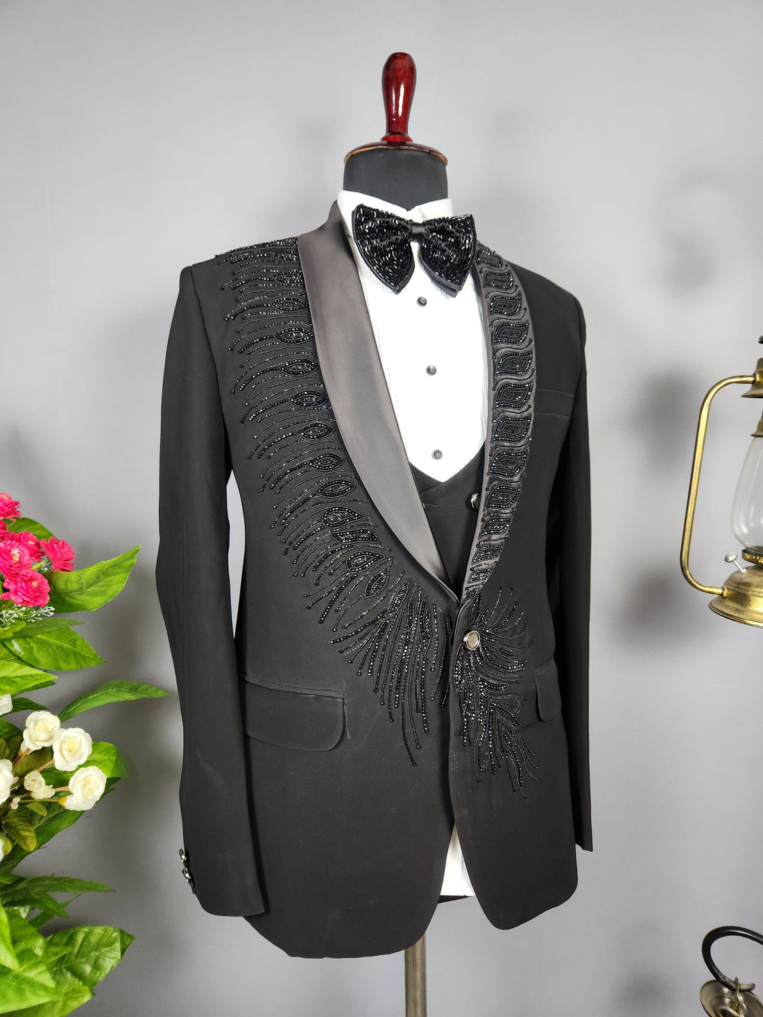 Men's black tuxedo suit for Indian groom, perfect for wedding and reception wear
