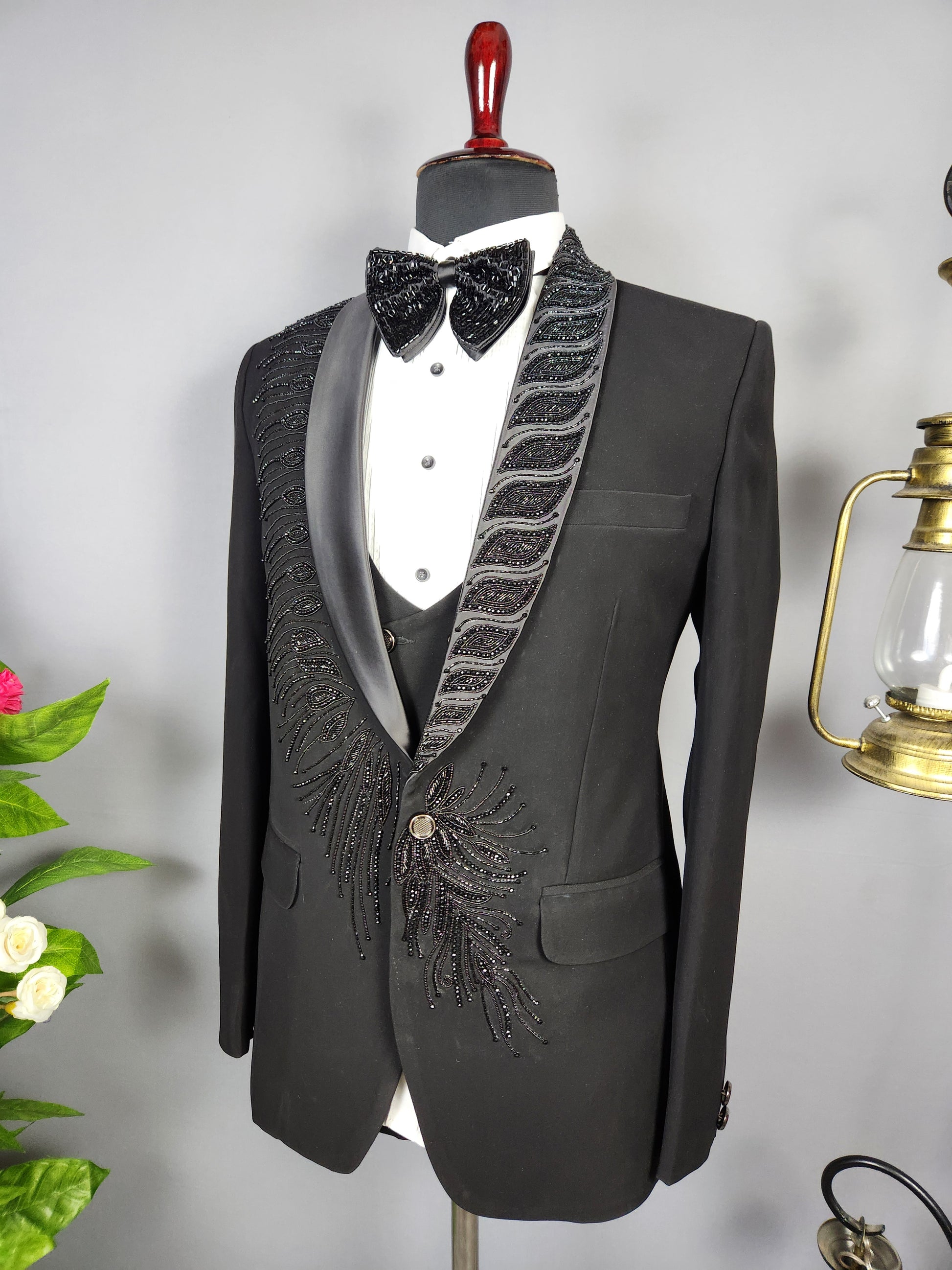 Men's black tuxedo suit for Indian groom, perfect for wedding and reception wear
