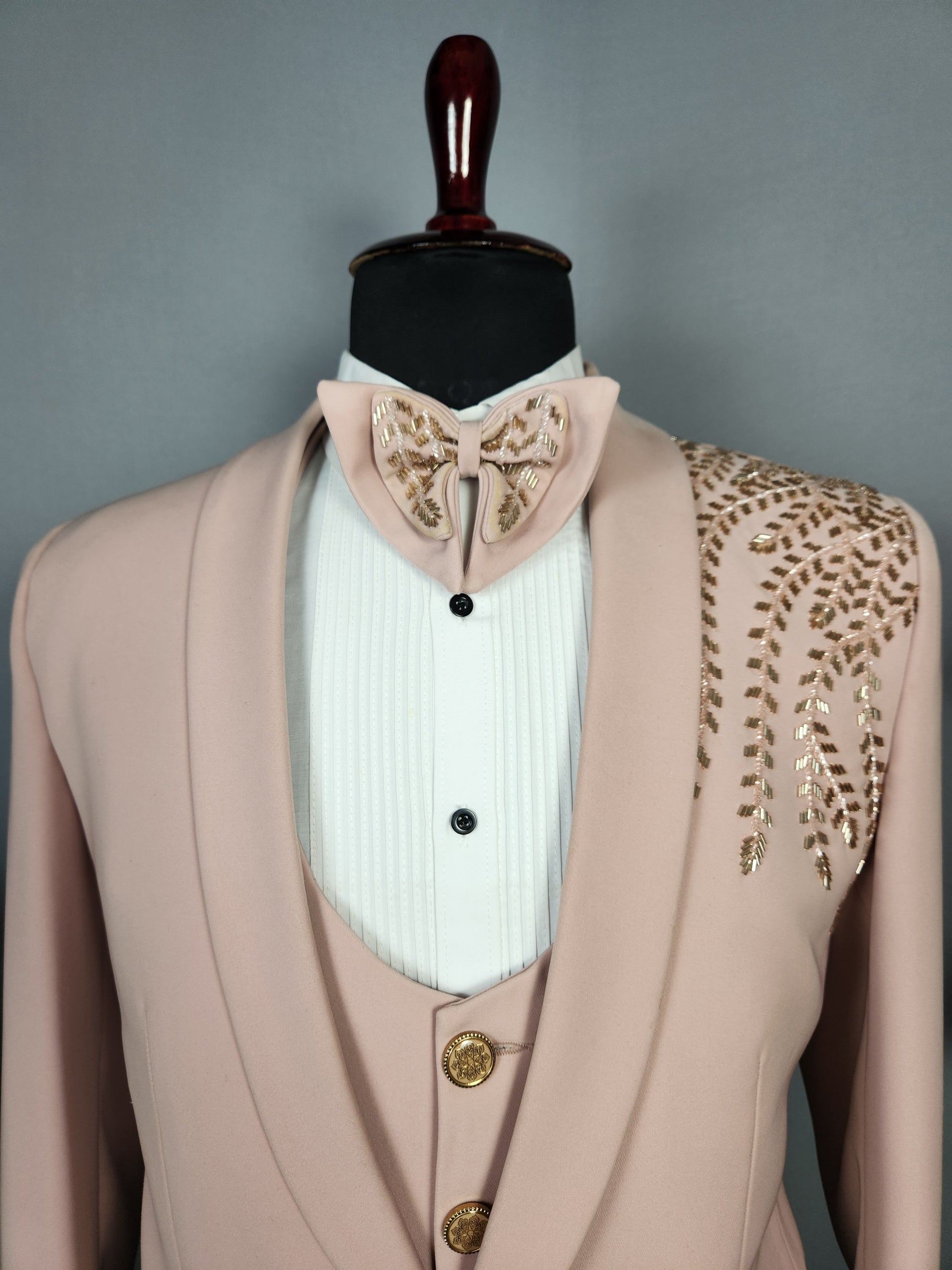 Men's dusty pink tuxedo suit for Indian groom, perfect for wedding and reception wear
