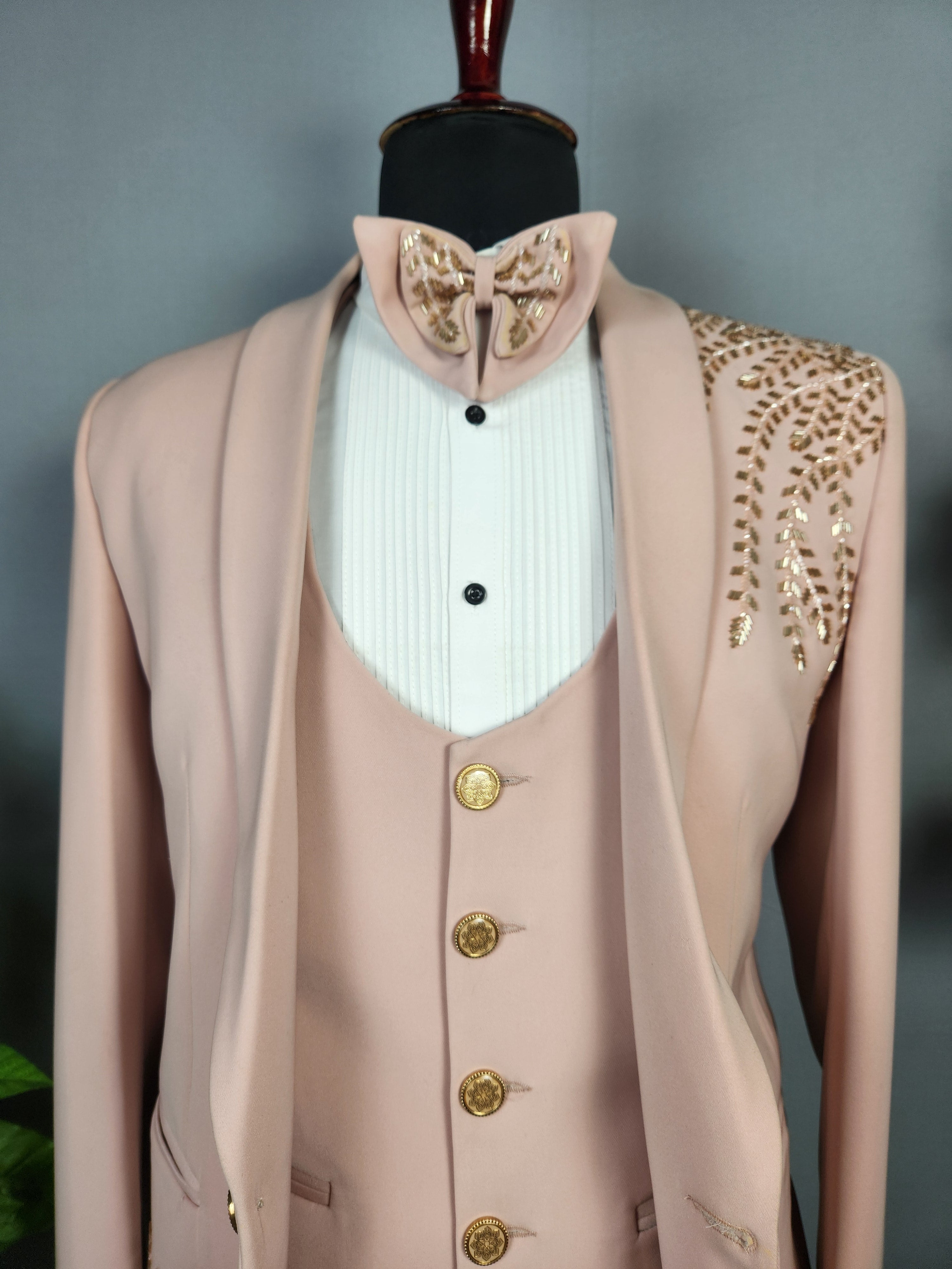 Men's dusty pink tuxedo suit for Indian groom, perfect for wedding and reception wear
