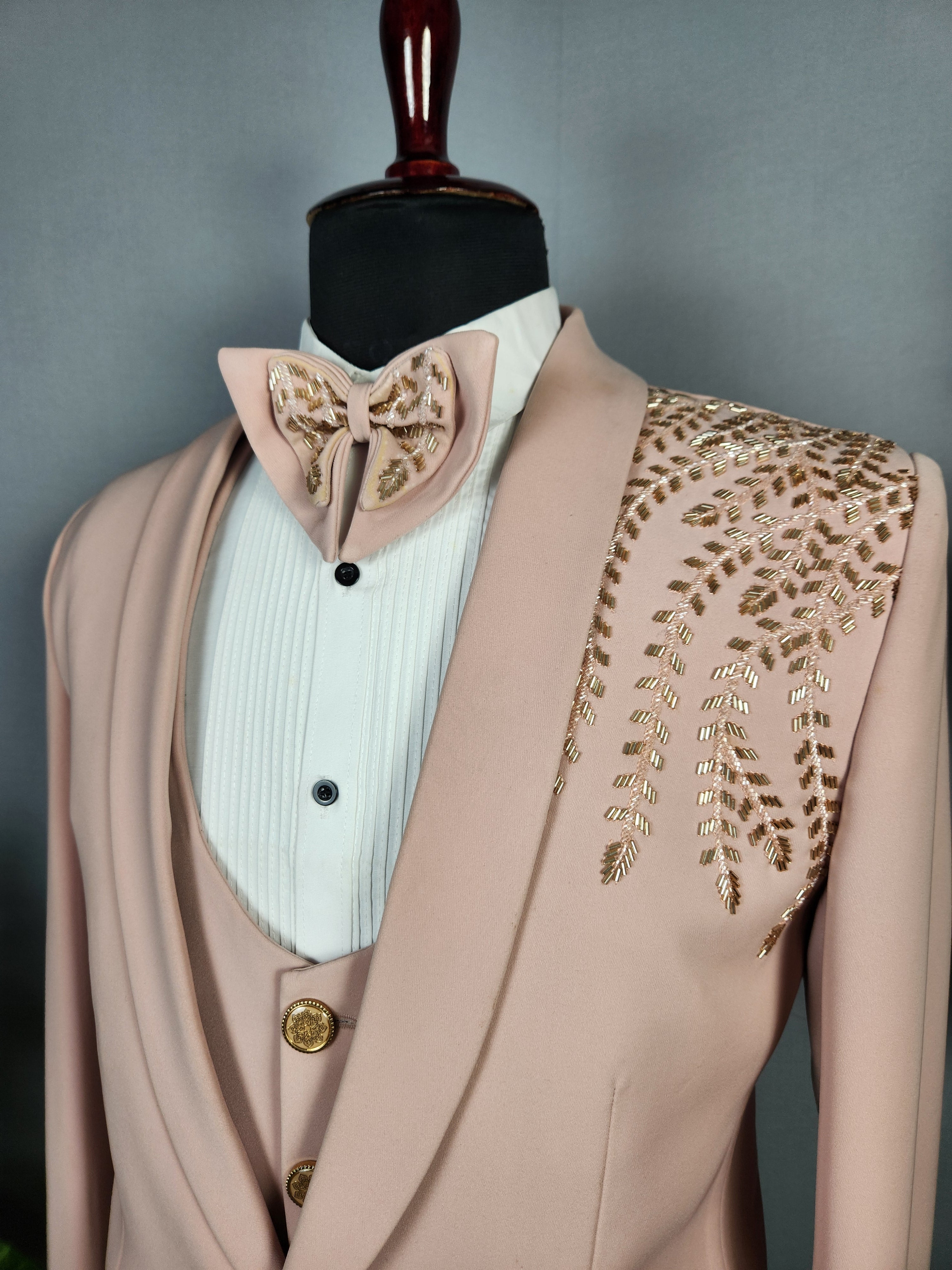 Men's dusty pink tuxedo suit for Indian groom, perfect for wedding and reception wear
