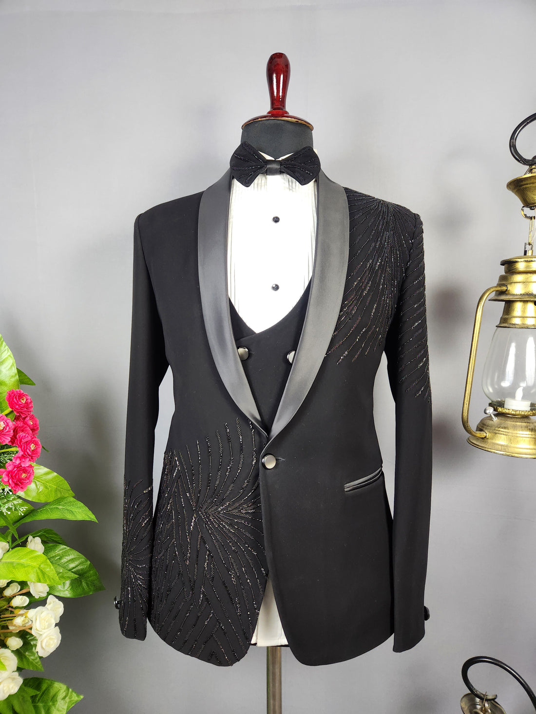 Men's black tuxedo suit for Indian groom, perfect for wedding and reception wear
