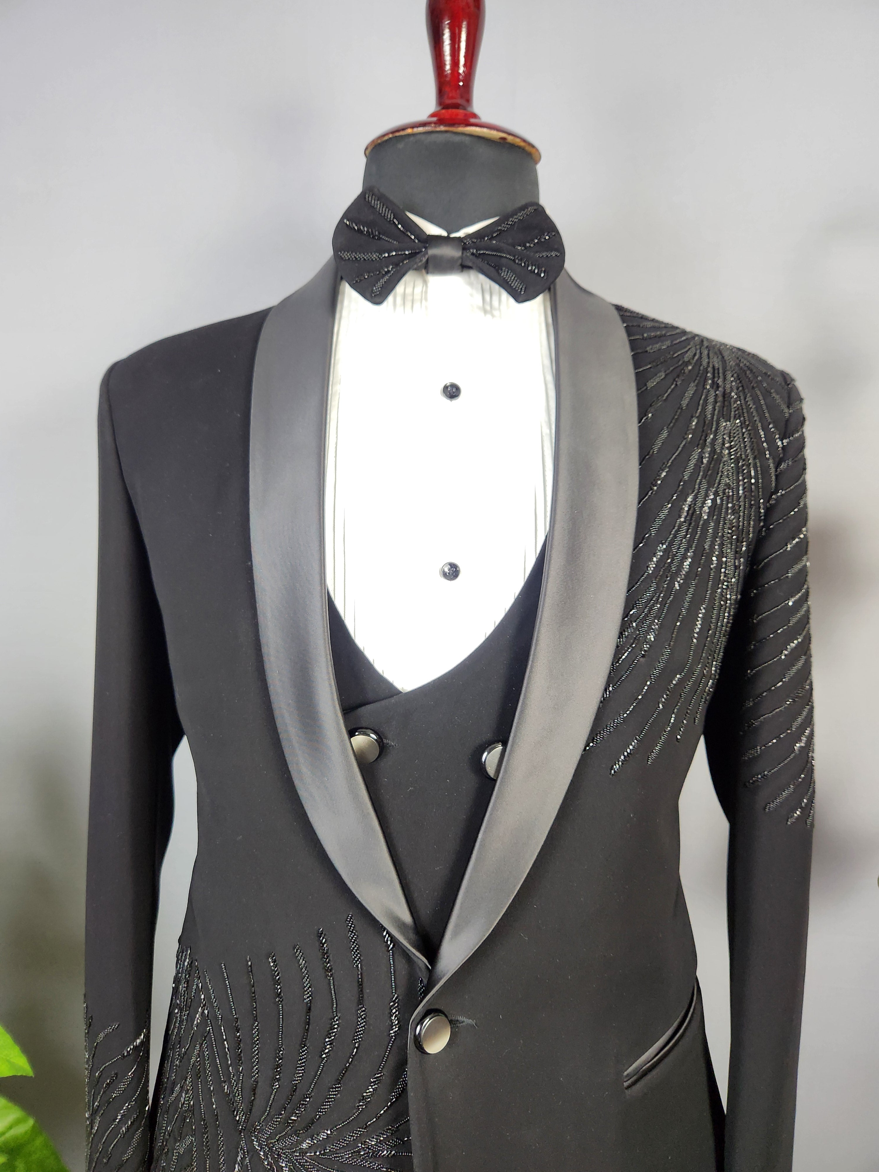 Men's black tuxedo suit for Indian groom, perfect for wedding and reception wear
