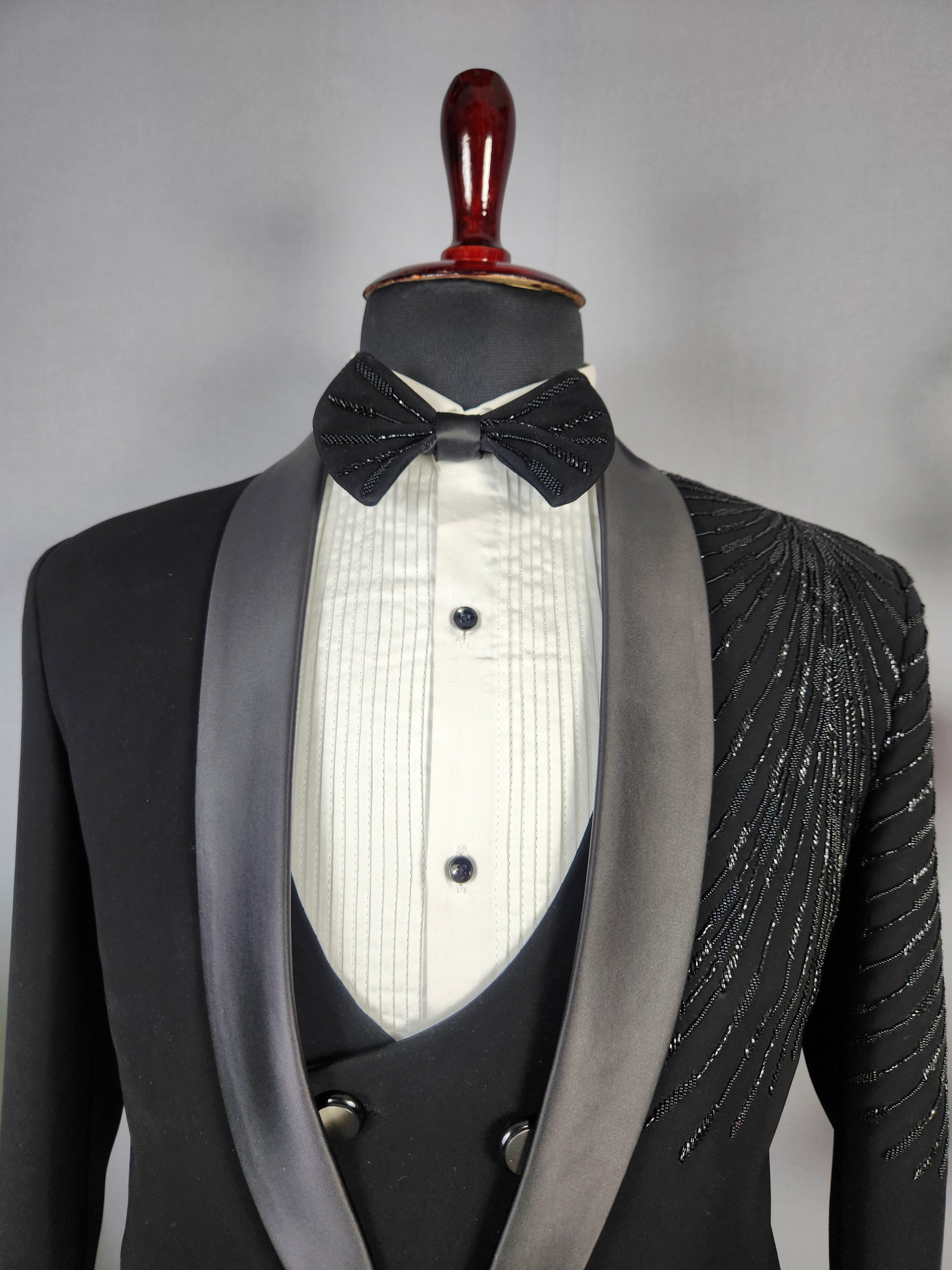 Men's black tuxedo suit for Indian groom, perfect for wedding and reception wear
