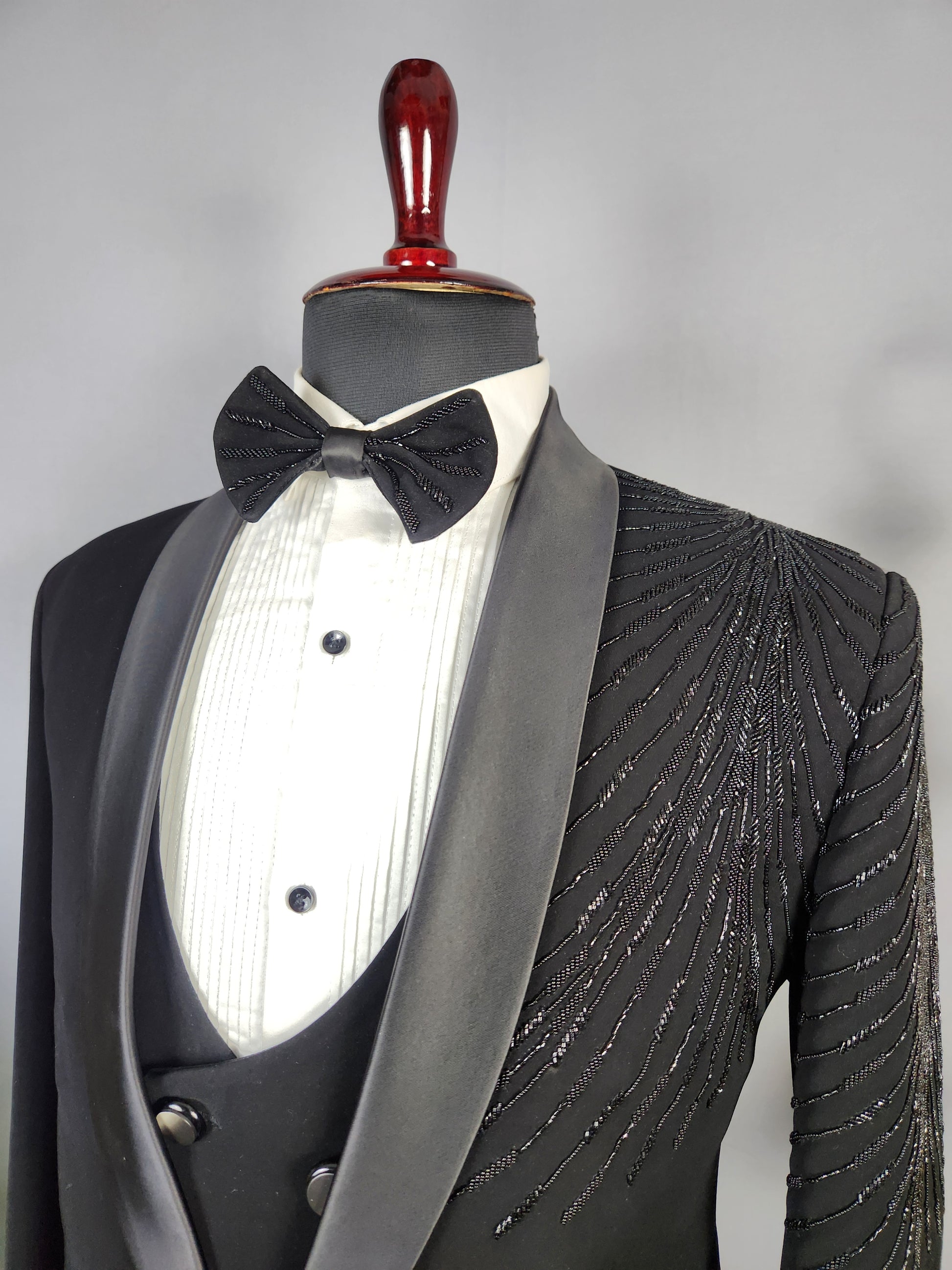 Men's black tuxedo suit for Indian groom, perfect for wedding and reception wear
