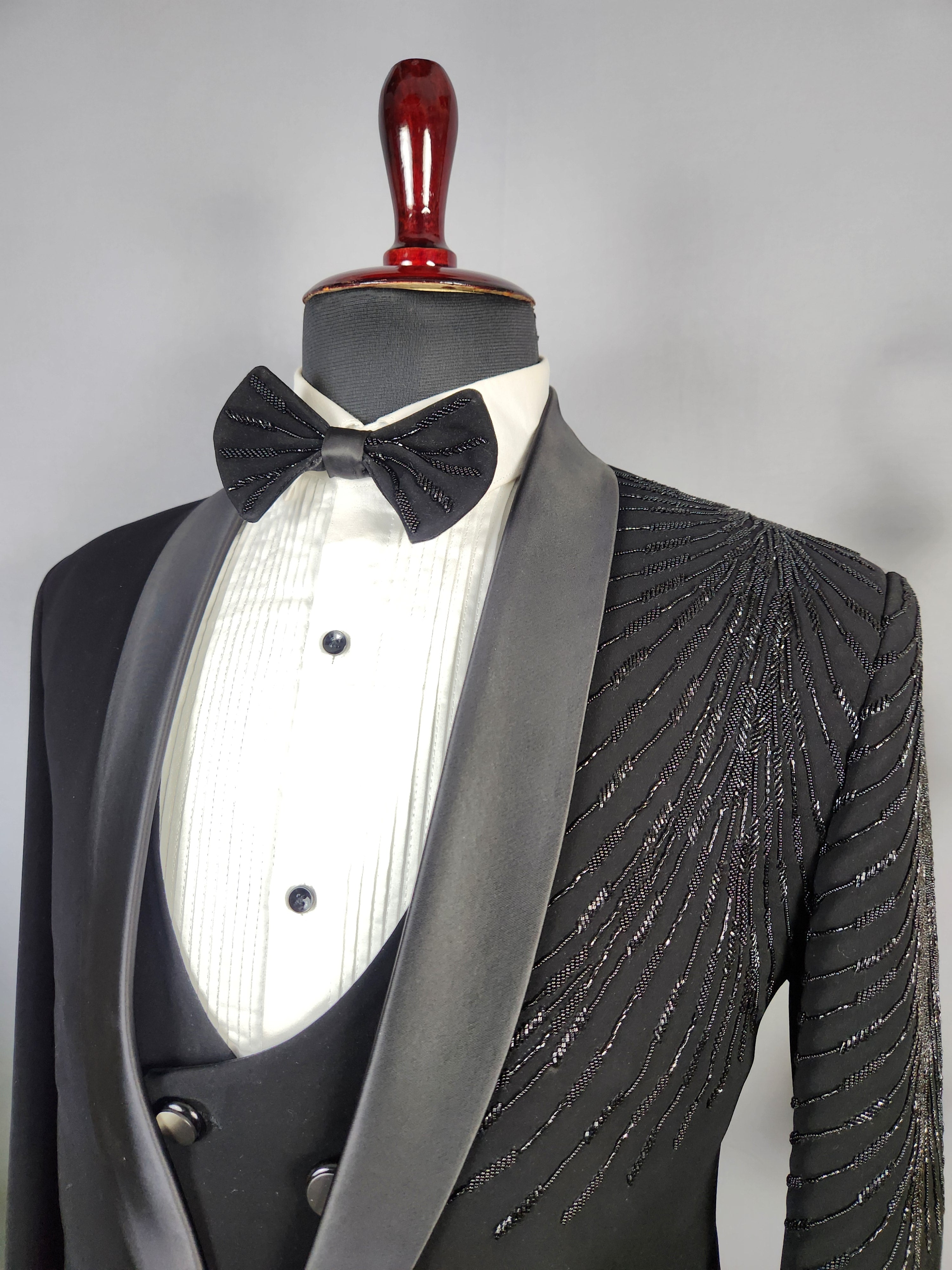 Men's black tuxedo suit for Indian groom, perfect for wedding and reception wear
