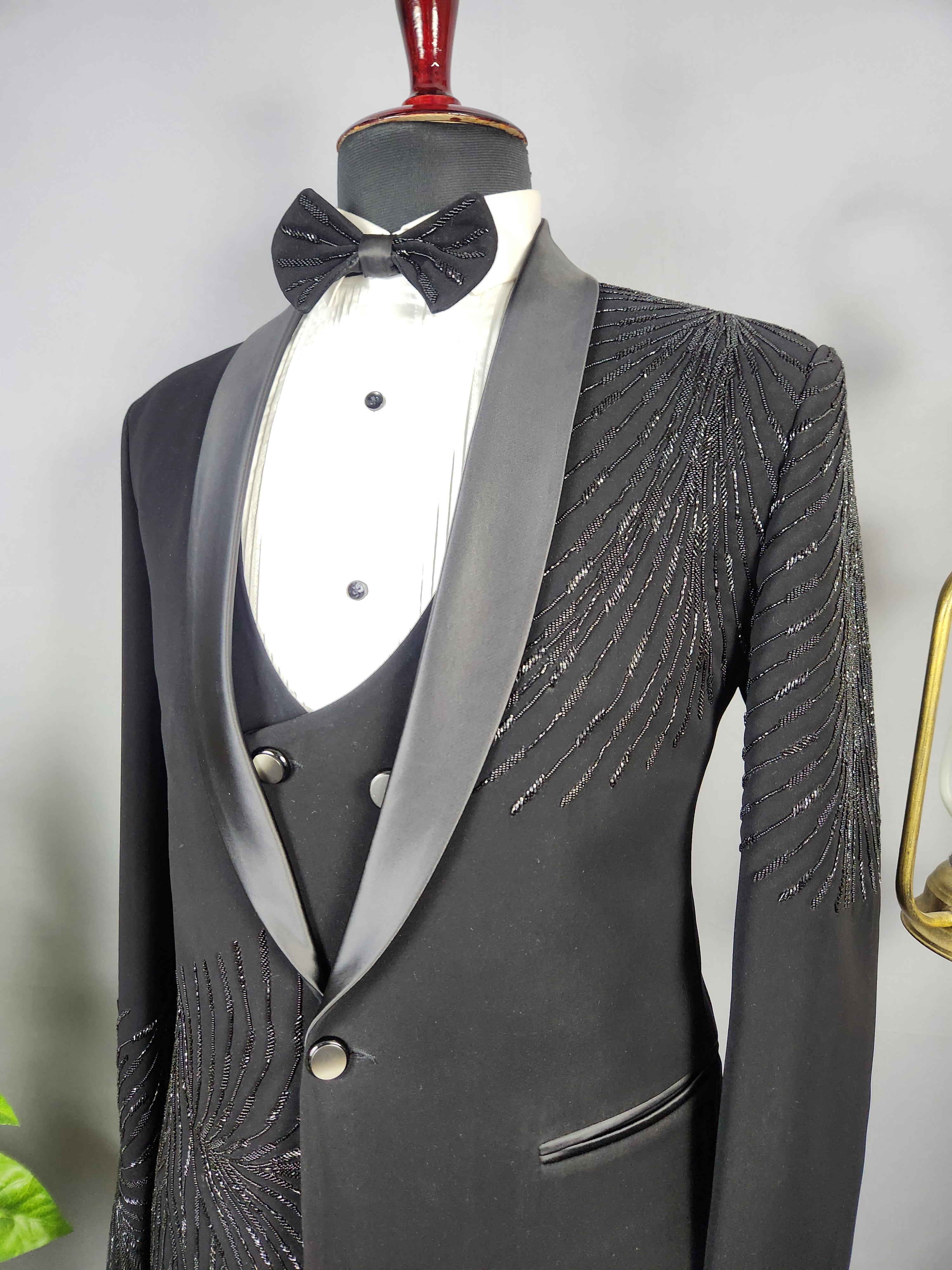 Men's black tuxedo suit for Indian groom, perfect for wedding and reception wear
