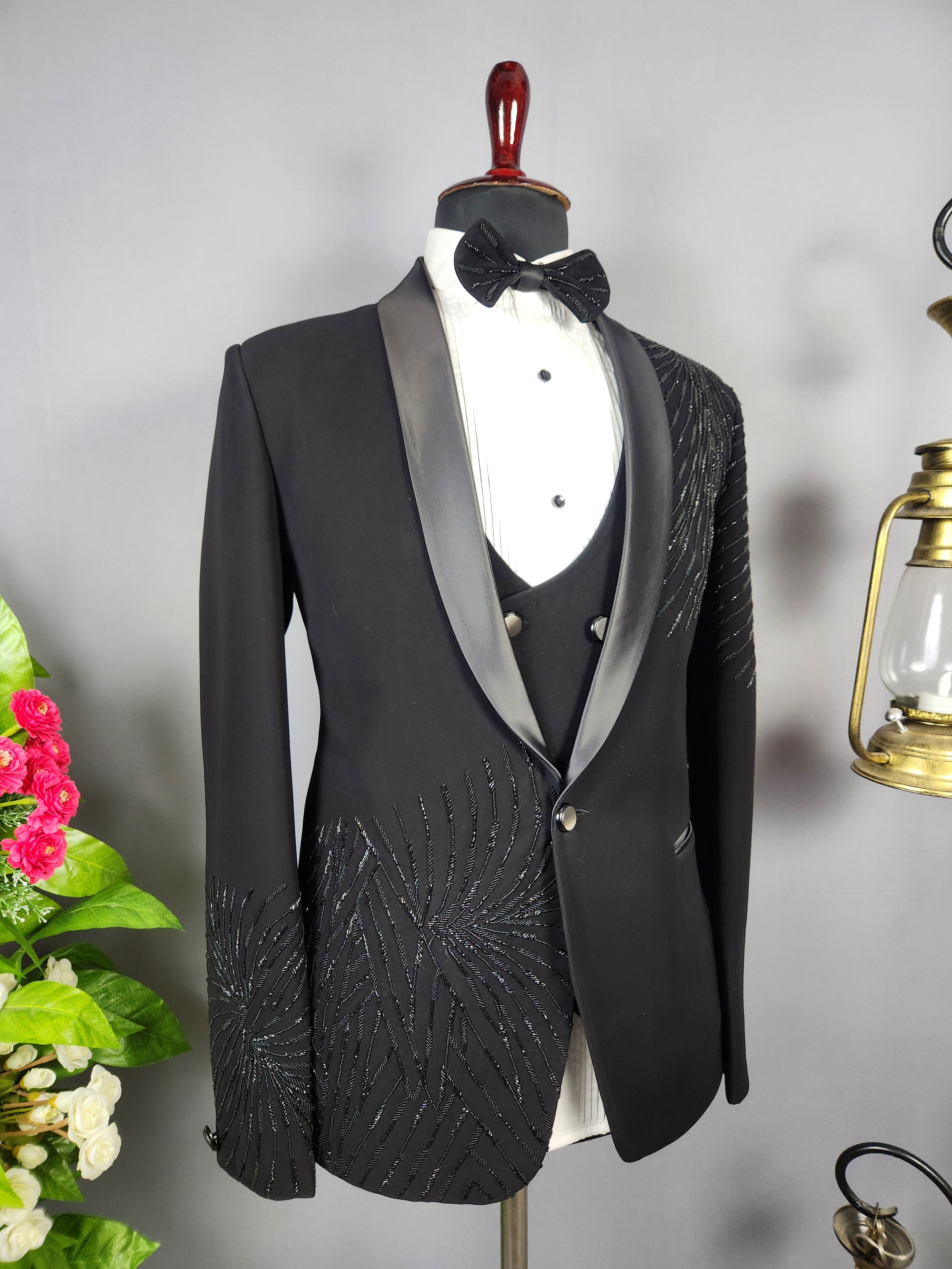 Men's black tuxedo suit for Indian groom, perfect for wedding and reception wear
