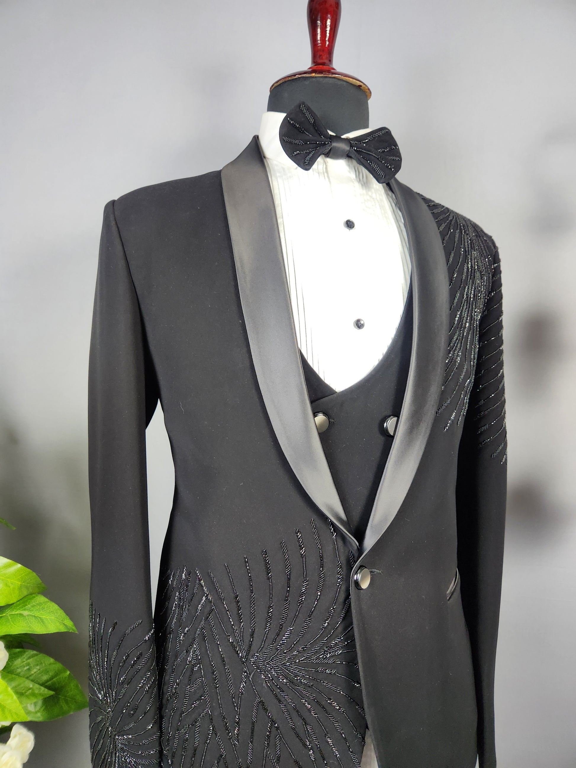 Men's black tuxedo suit for Indian groom, perfect for wedding and reception wear
