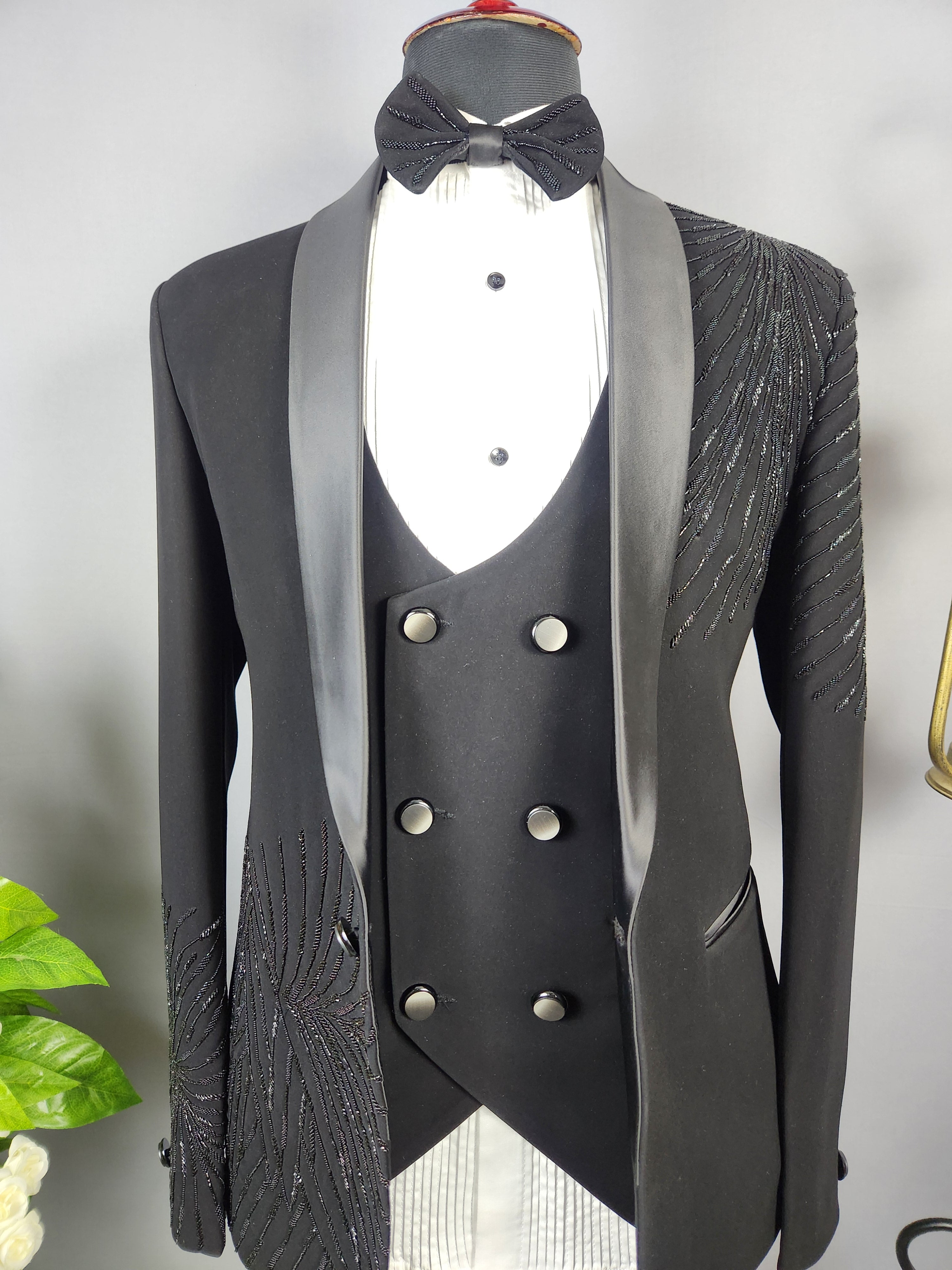Men's black tuxedo suit for Indian groom, perfect for wedding and reception wear
