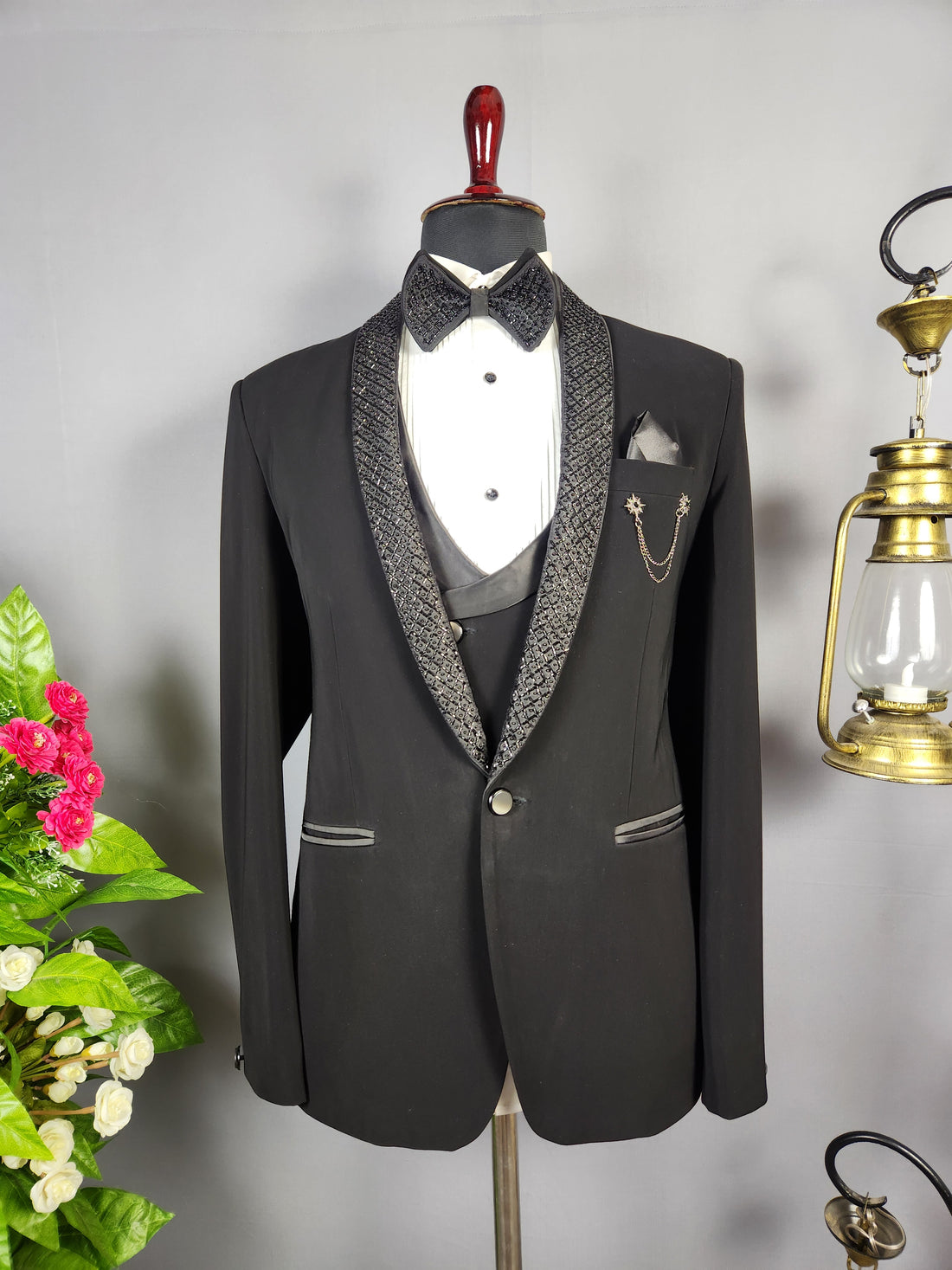 Men's black tuxedo suit for Indian groom, perfect for wedding and reception wear
