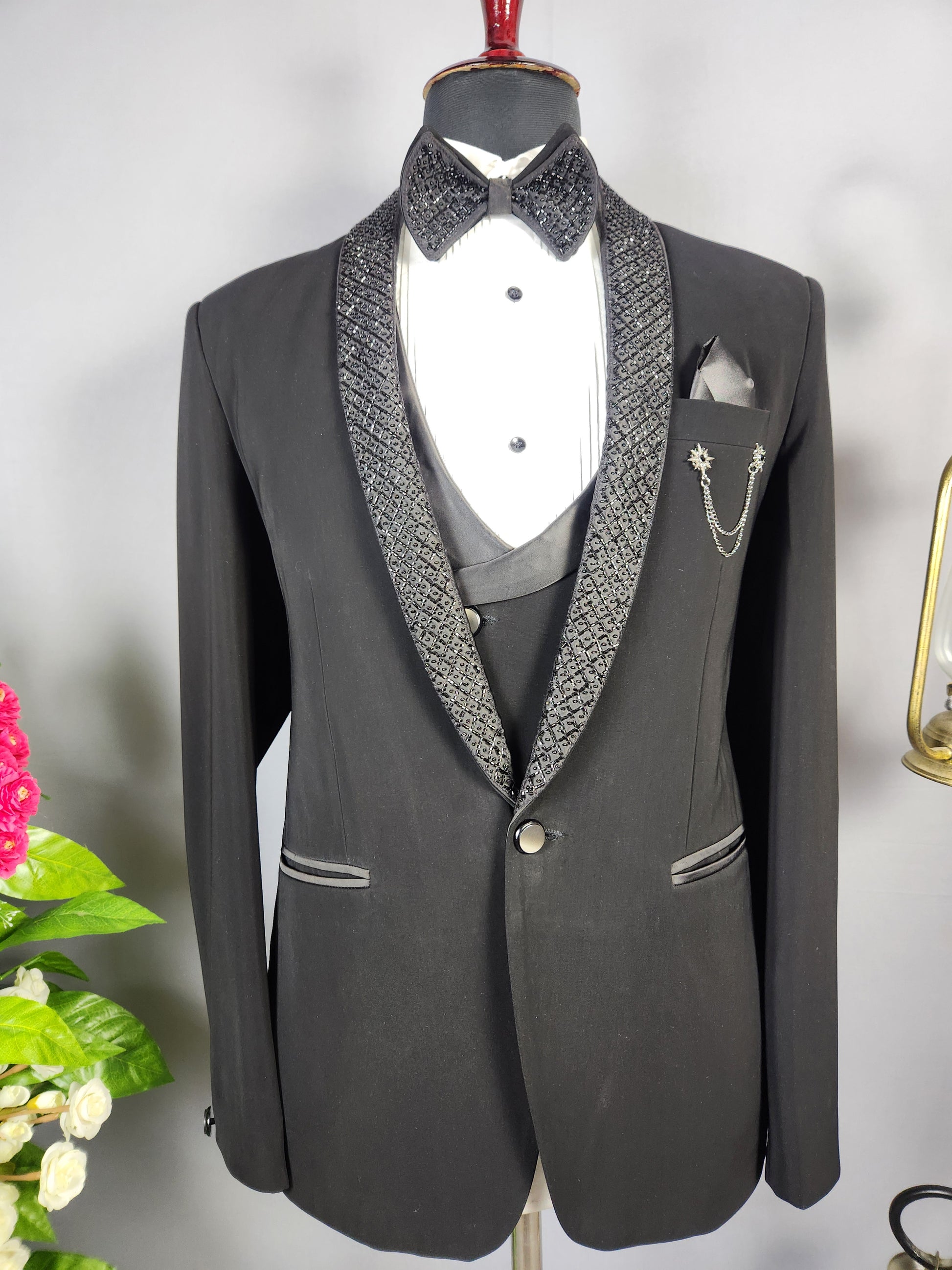 Men's black tuxedo suit for Indian groom, perfect for wedding and reception wear
