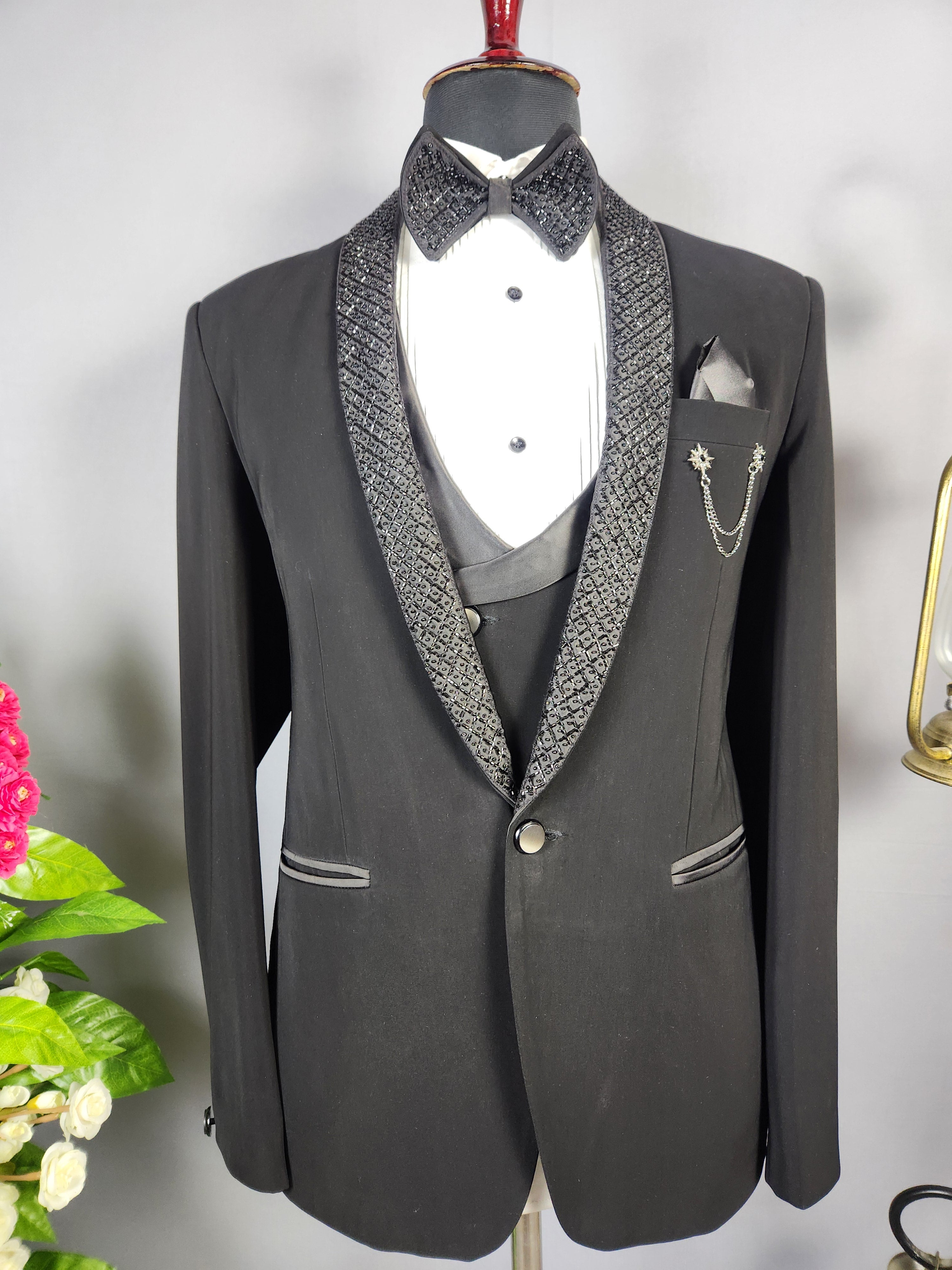 Men's black tuxedo suit for Indian groom, perfect for wedding and reception wear
