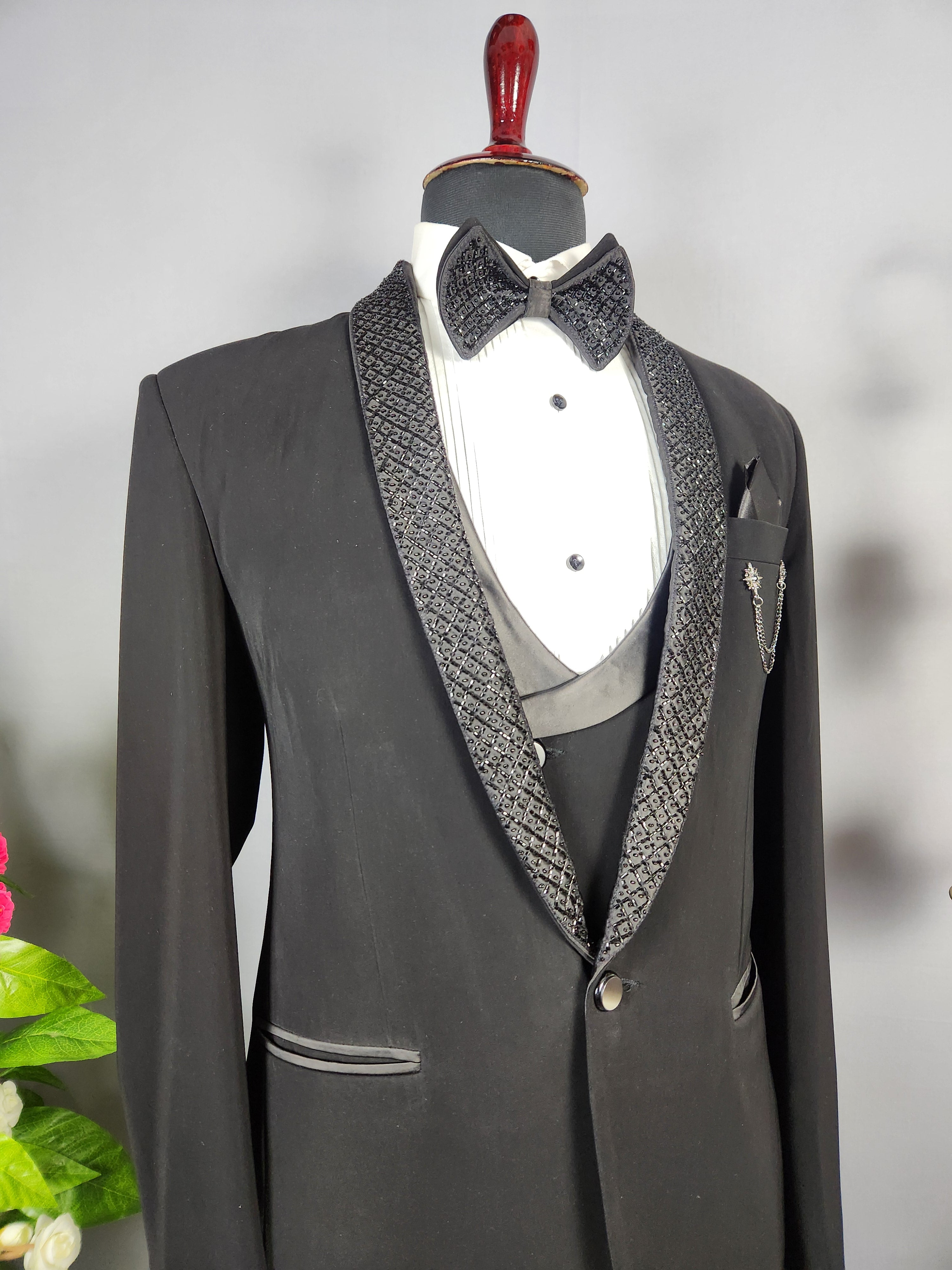Men's black tuxedo suit for Indian groom, perfect for wedding and reception wear
