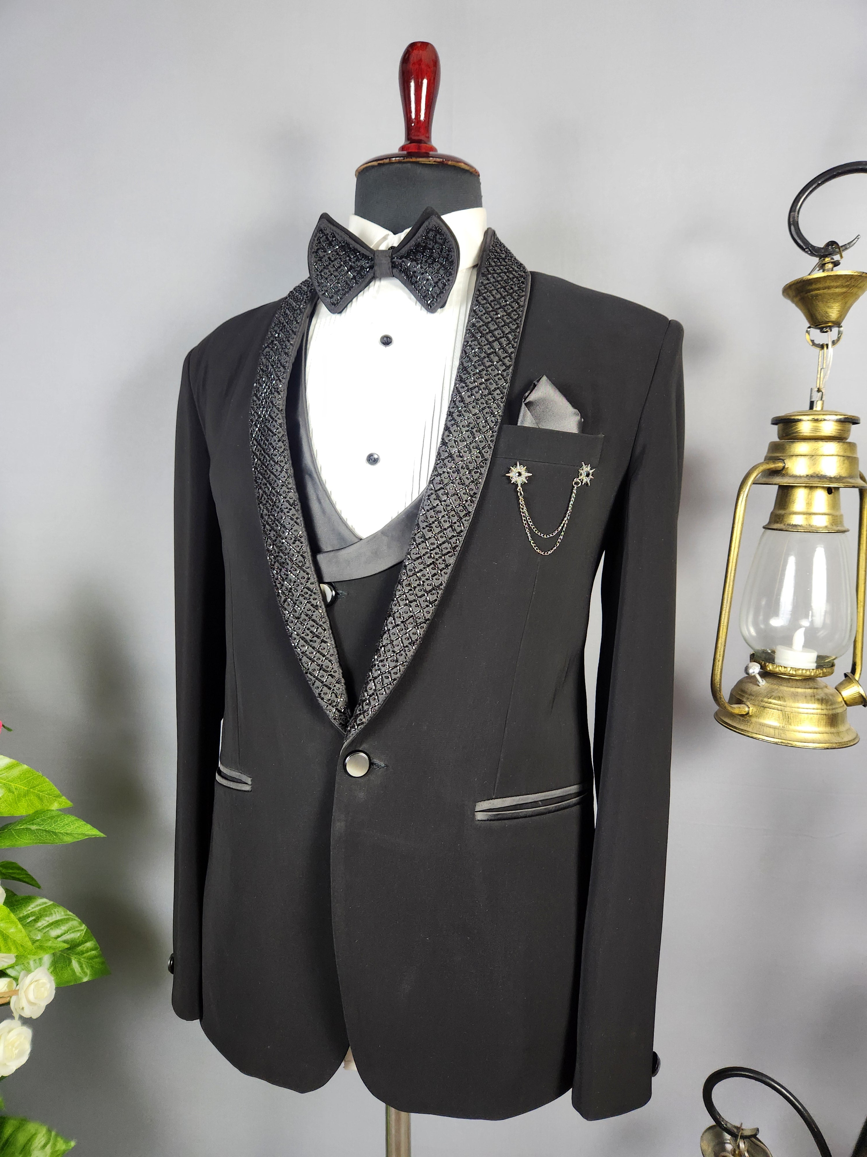 Men's black tuxedo suit for Indian groom, perfect for wedding and reception wear
