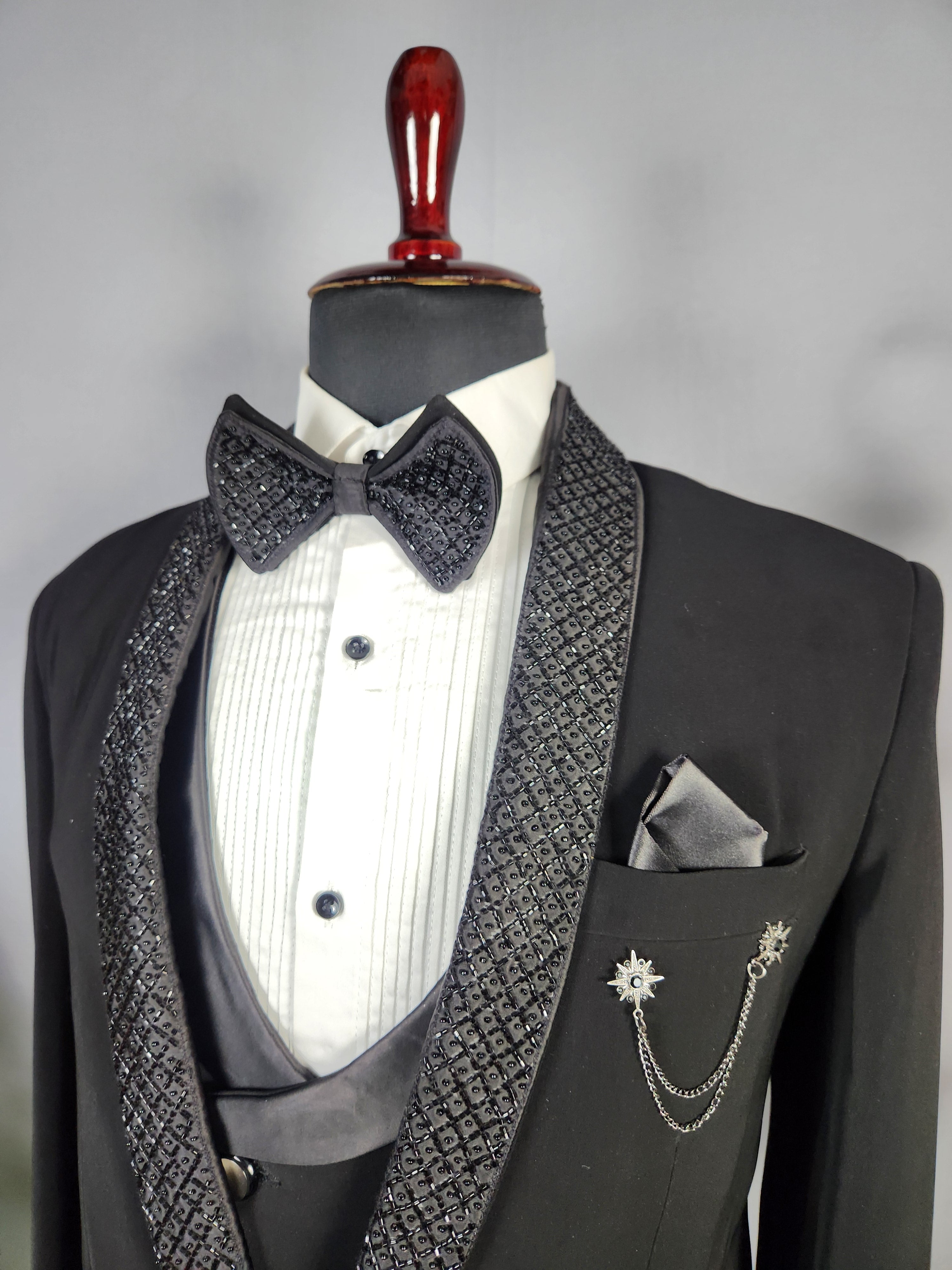 Men's black tuxedo suit for Indian groom, perfect for wedding and reception wear
