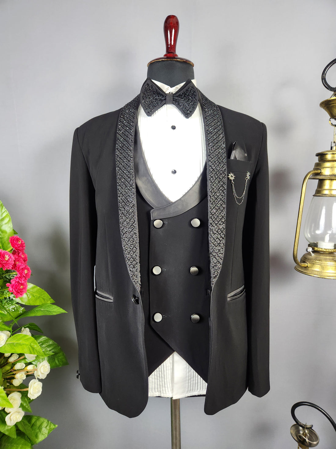 Men's black tuxedo suit for Indian groom, perfect for wedding and reception wear
