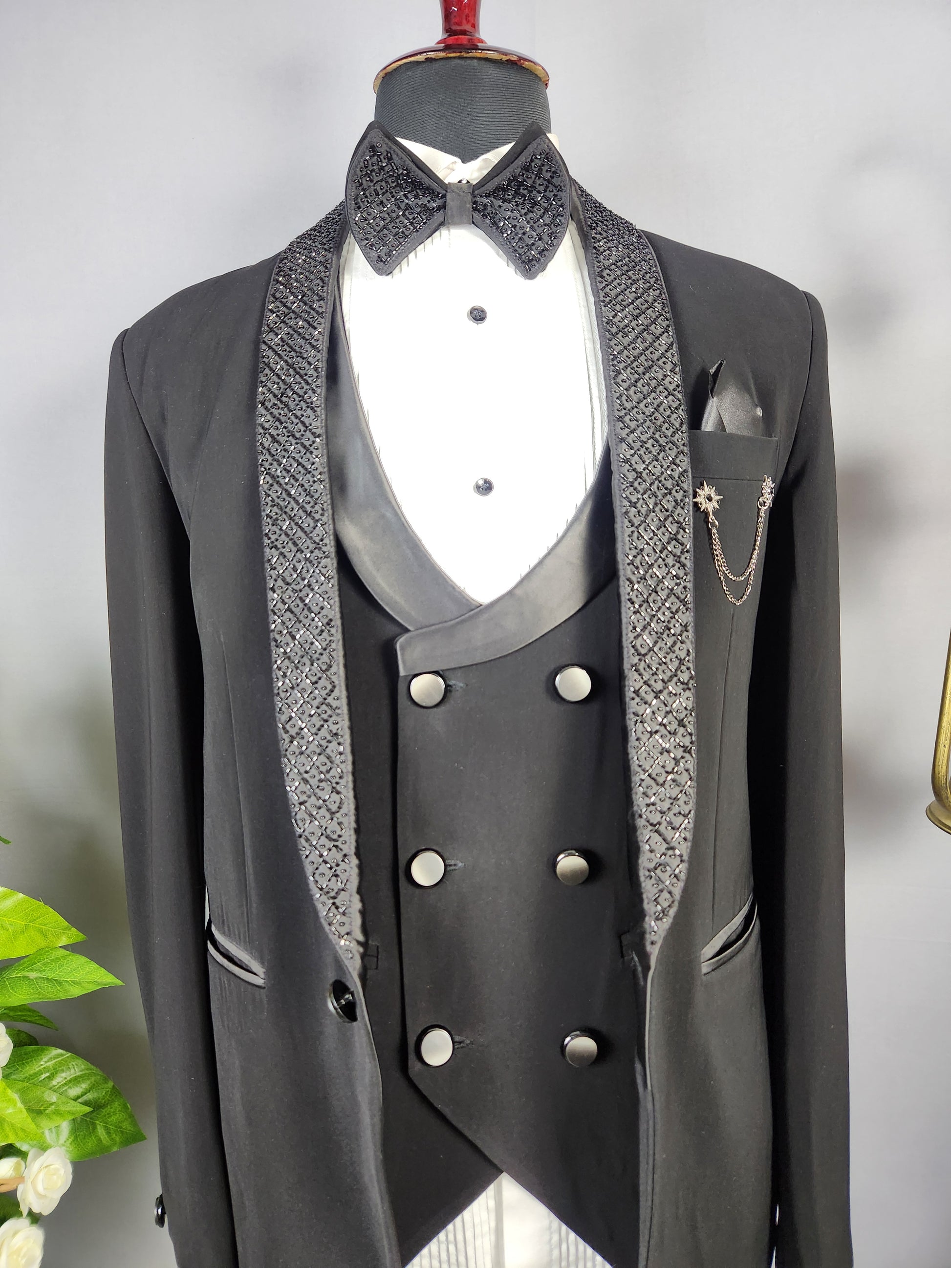 Men's black tuxedo suit for Indian groom, perfect for wedding and reception wear

