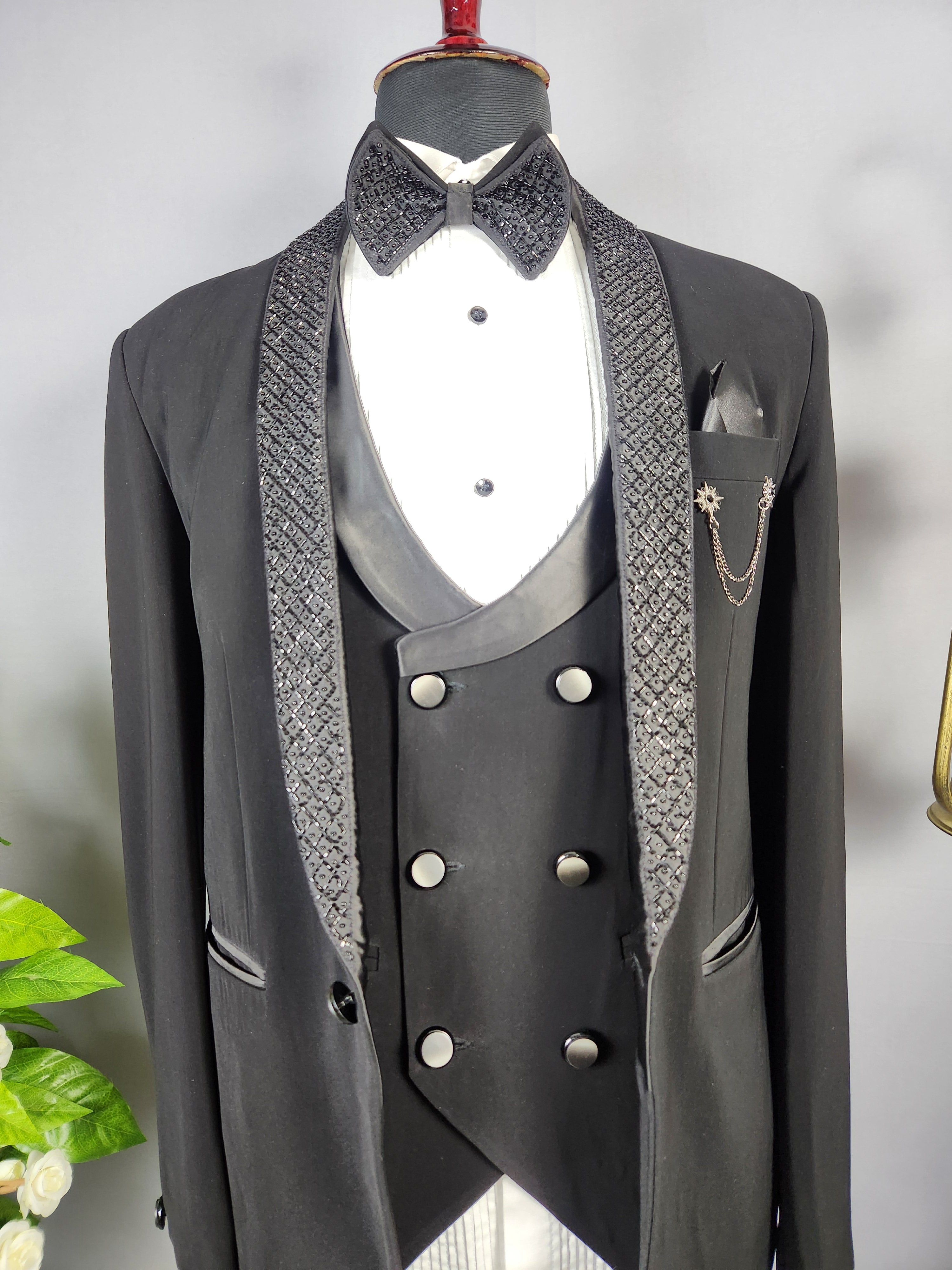 Men's black tuxedo suit for Indian groom, perfect for wedding and reception wear
